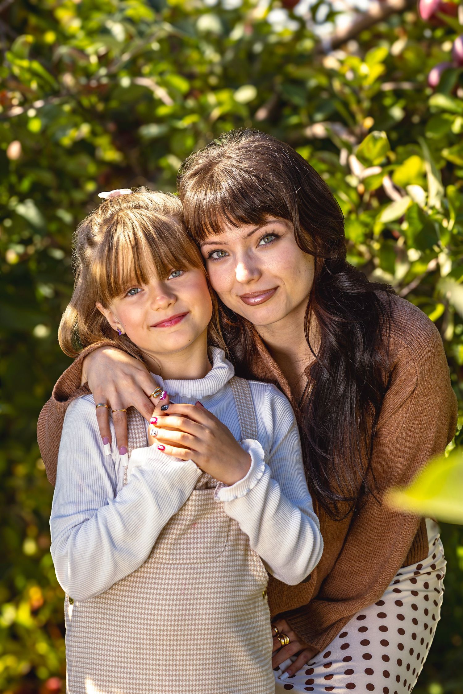 Mother and daughter in the orchard