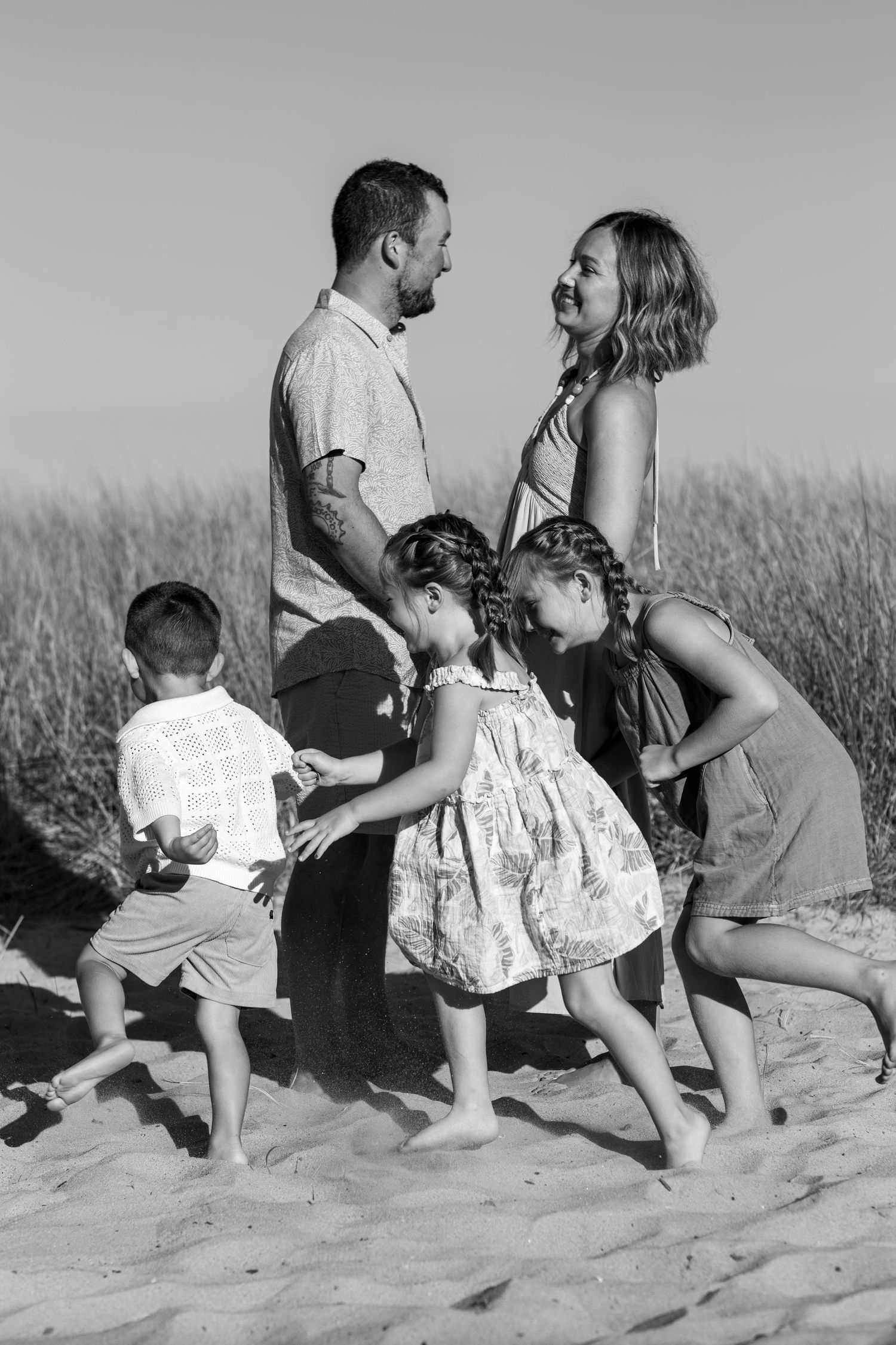 Black and White Family Photo in Old Orchard Beach in front of dune grass