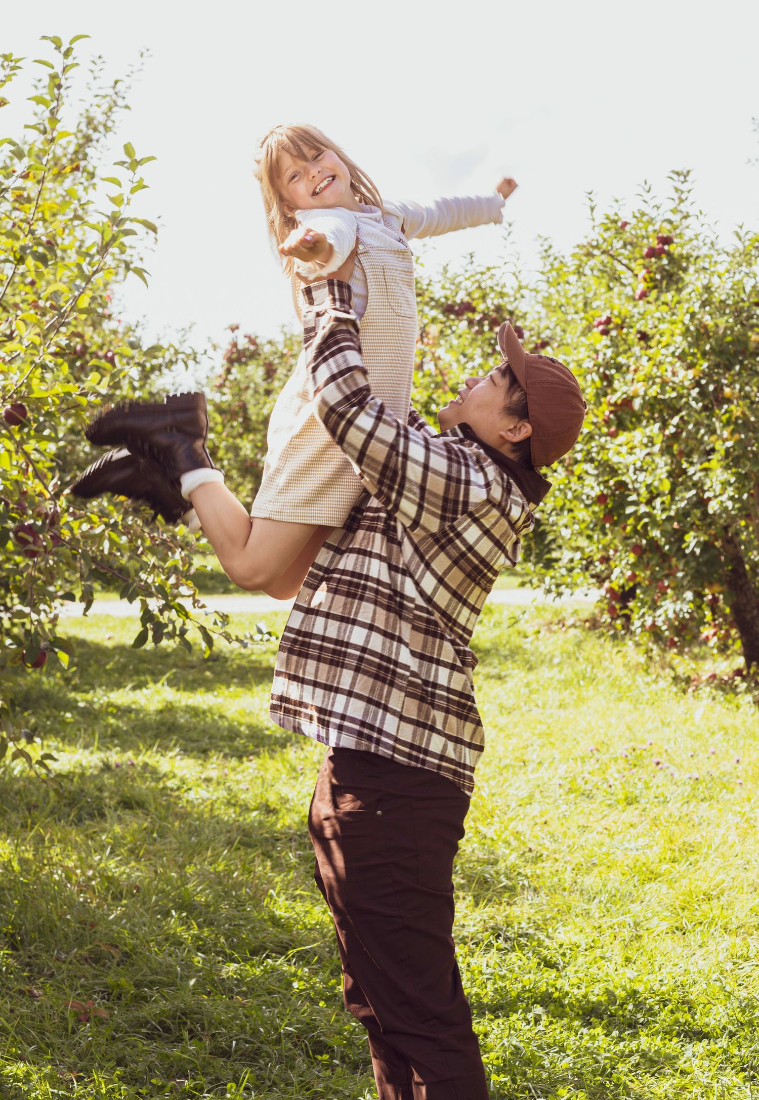 Young girl being lifted into the air