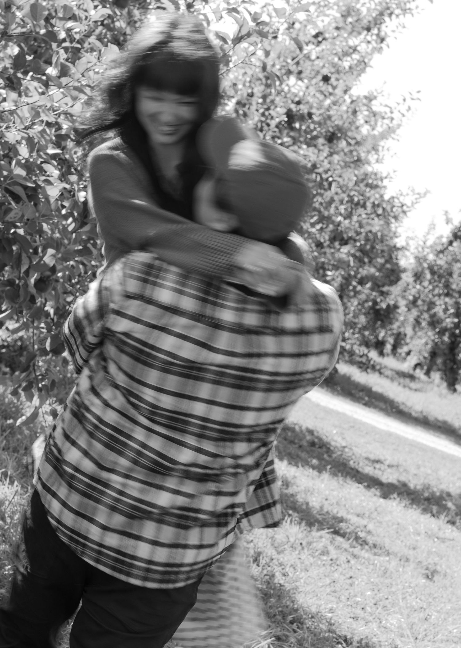Black and white photo of a couple twirling