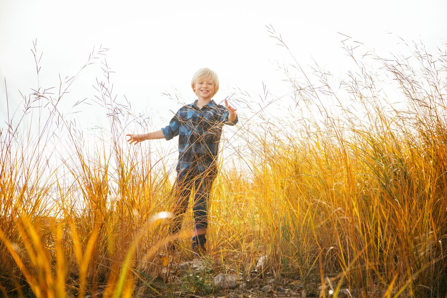Child posing naturally during a family photography session in Île-Perrot