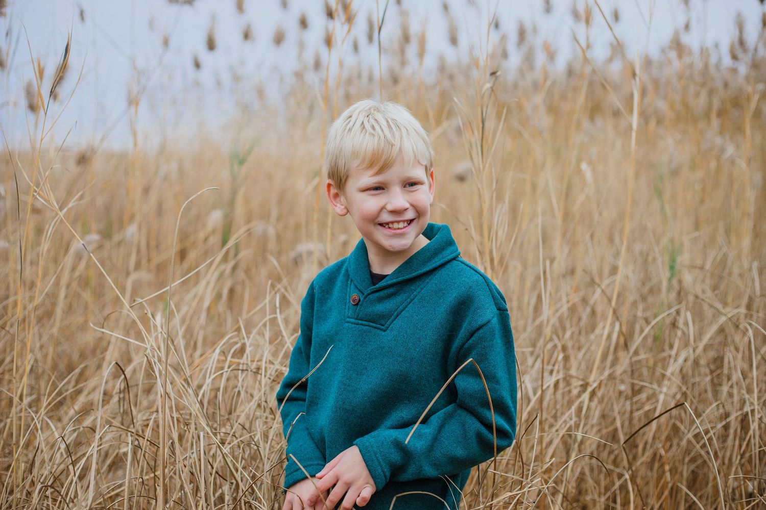 Child posing naturally during a family photography session in Île-Perrot