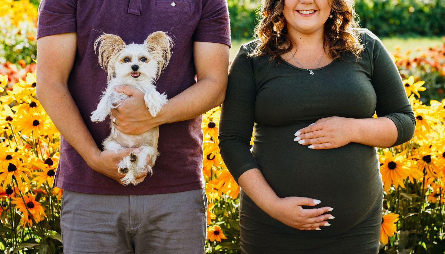 Expectant couple enjoying a natural maternity photography session at La Belle in Coteau-du-Lac