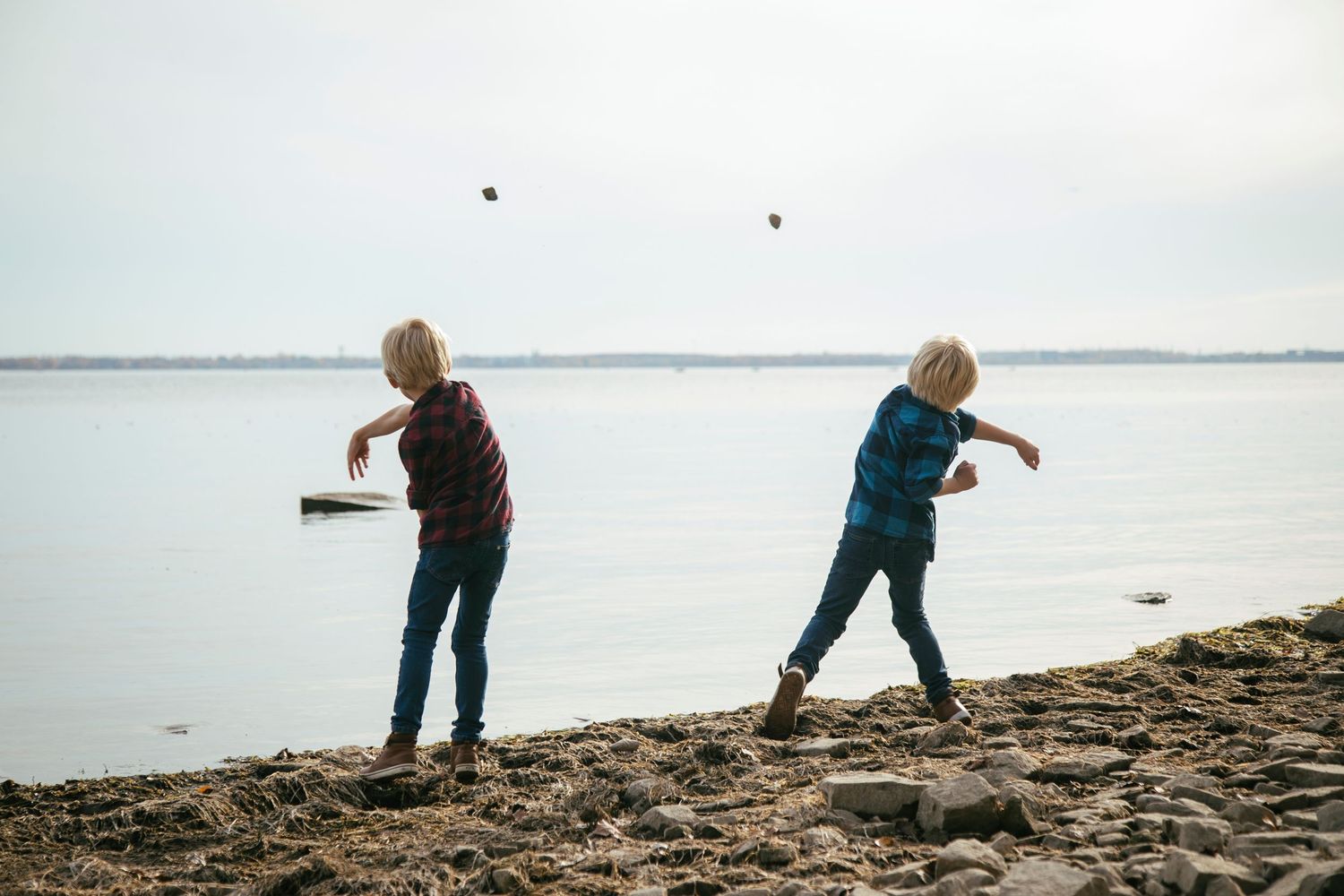 Brothers sharing a playful moment during an outdoor photography session in Île-Perrot