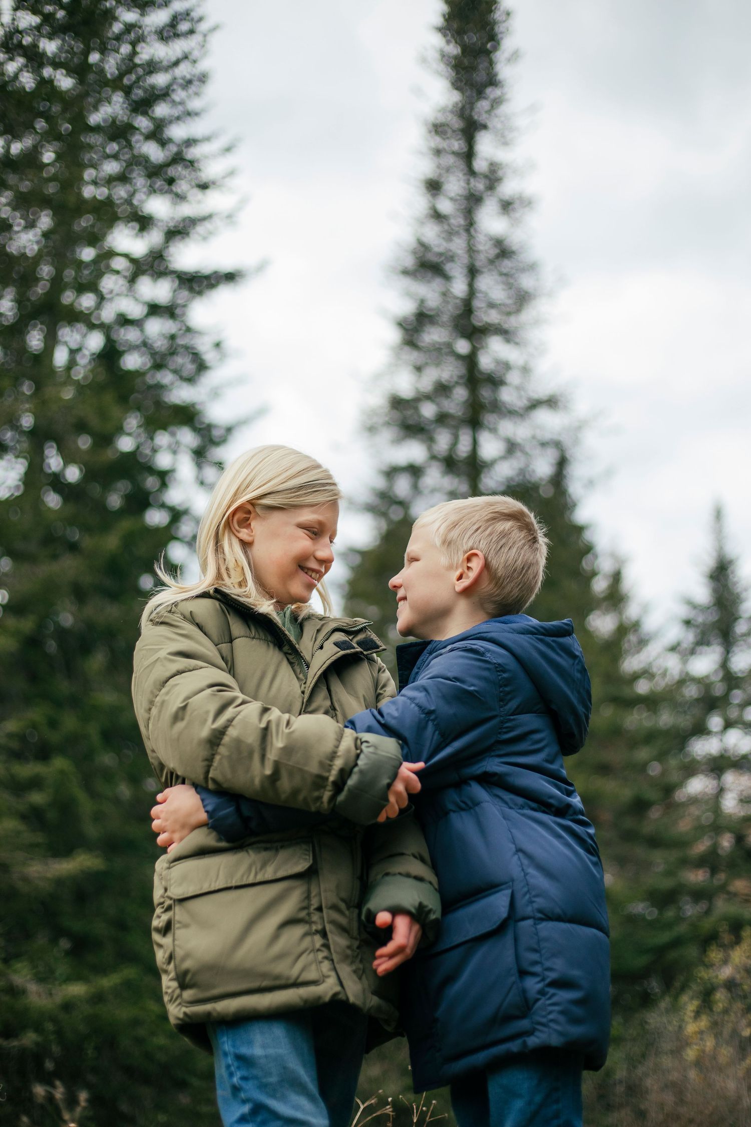 Brothers sharing a playful moment during an outdoor photography session in Île-Perrot