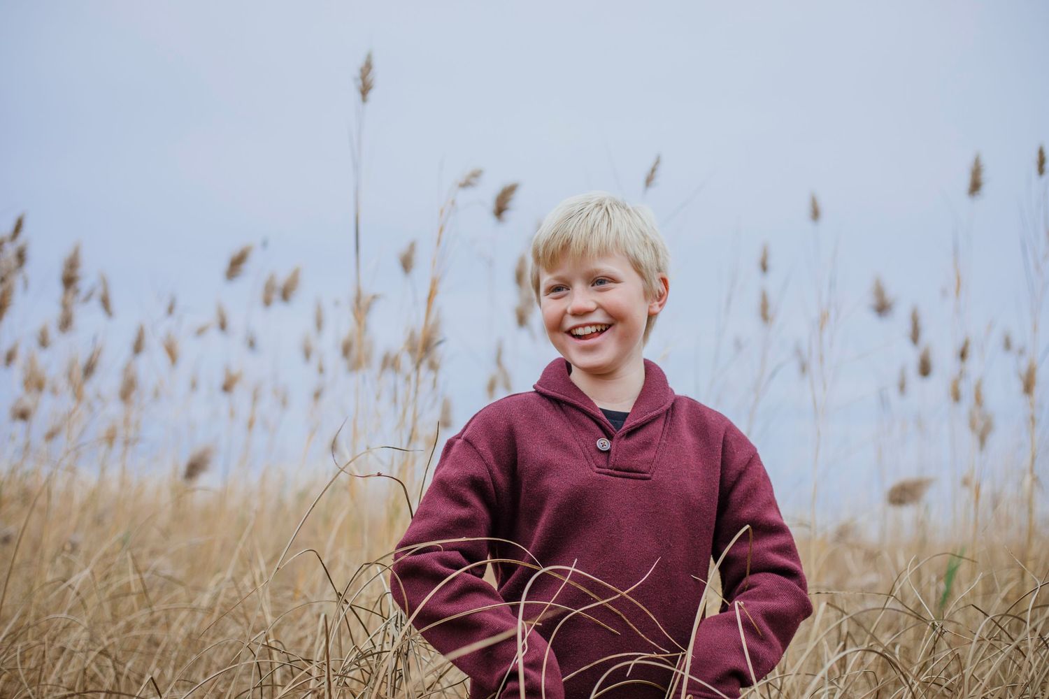 Child posing naturally during a family photography session in Île-Perrot