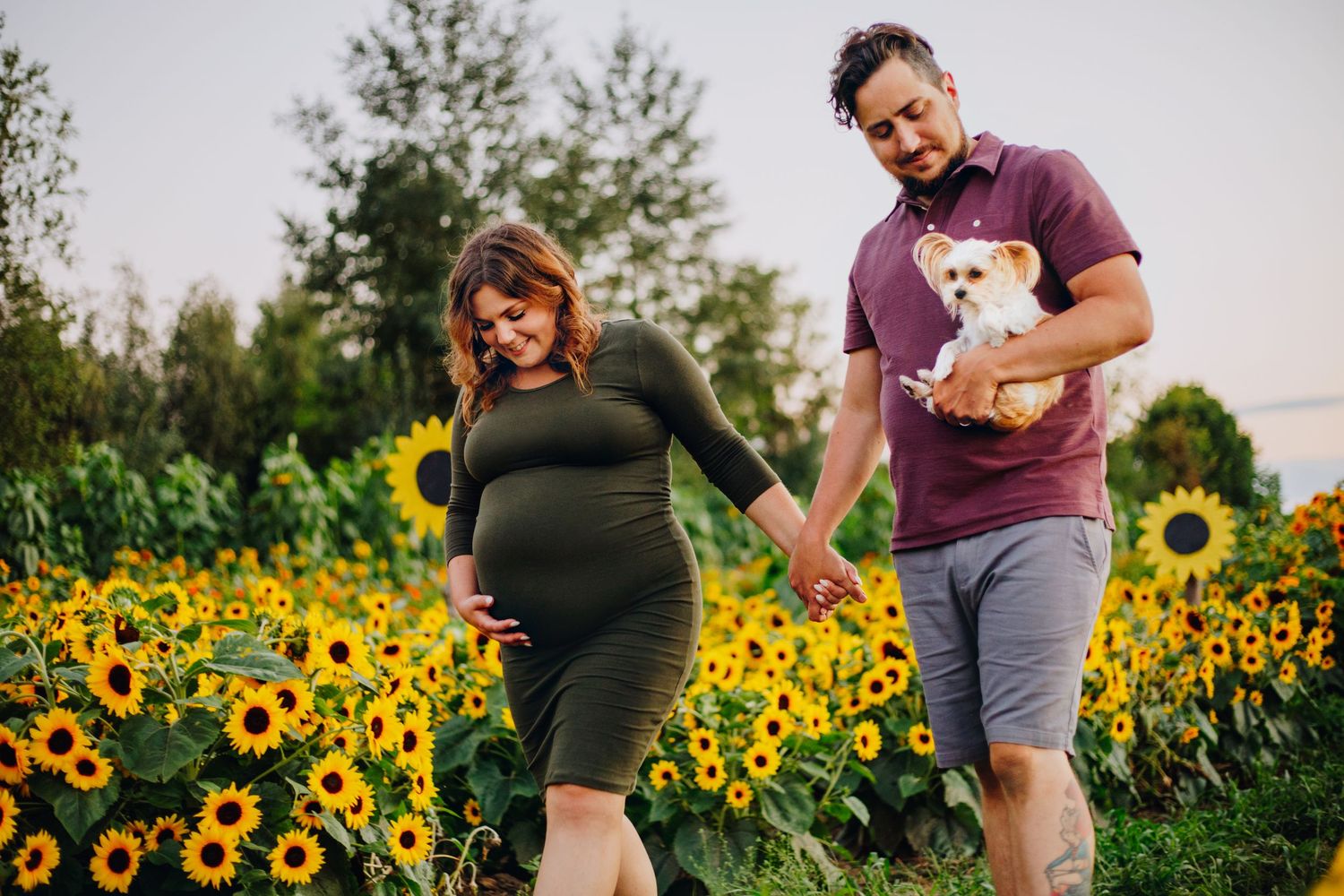 Expectant couple enjoying a natural maternity photography session at La Belle in Coteau-du-Lac