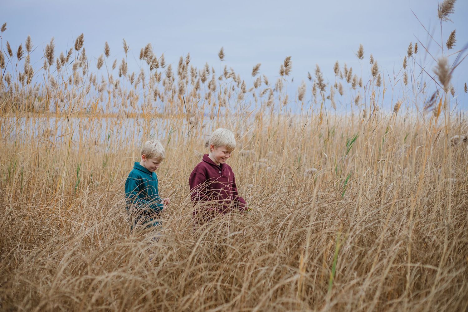 Brothers sharing a playful moment during an outdoor photography session in Île-Perrot