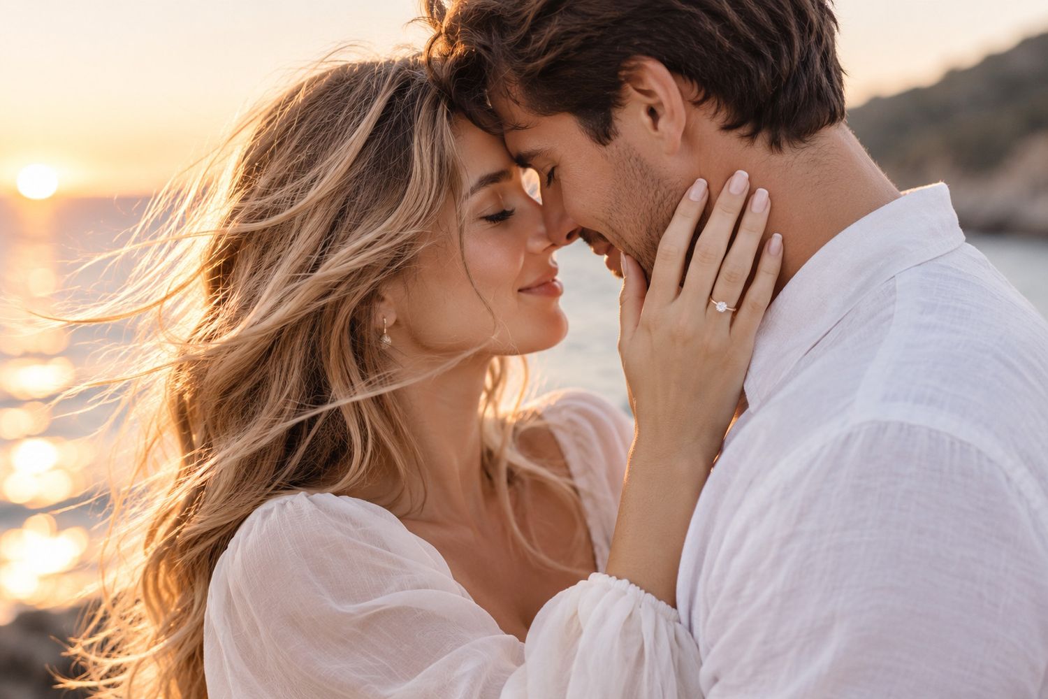 Romantic couple almost kissing at sunset by the sea, woman touching man's face wearing an engagement ring.
