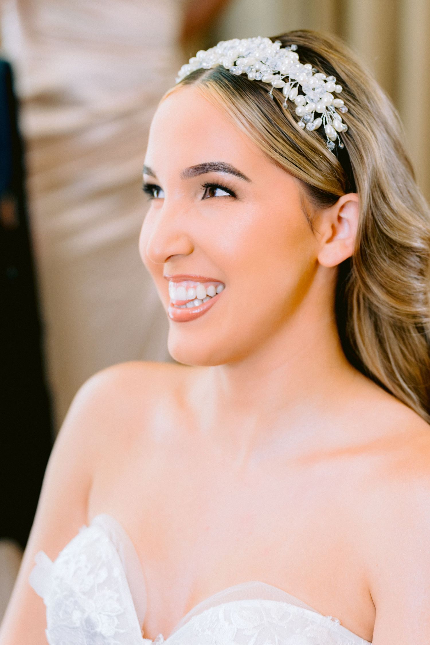 Close-up bridal portraits showing delicate white floral headpiece and elegant wedding hairstyle details. Tampa Wedding Photographer