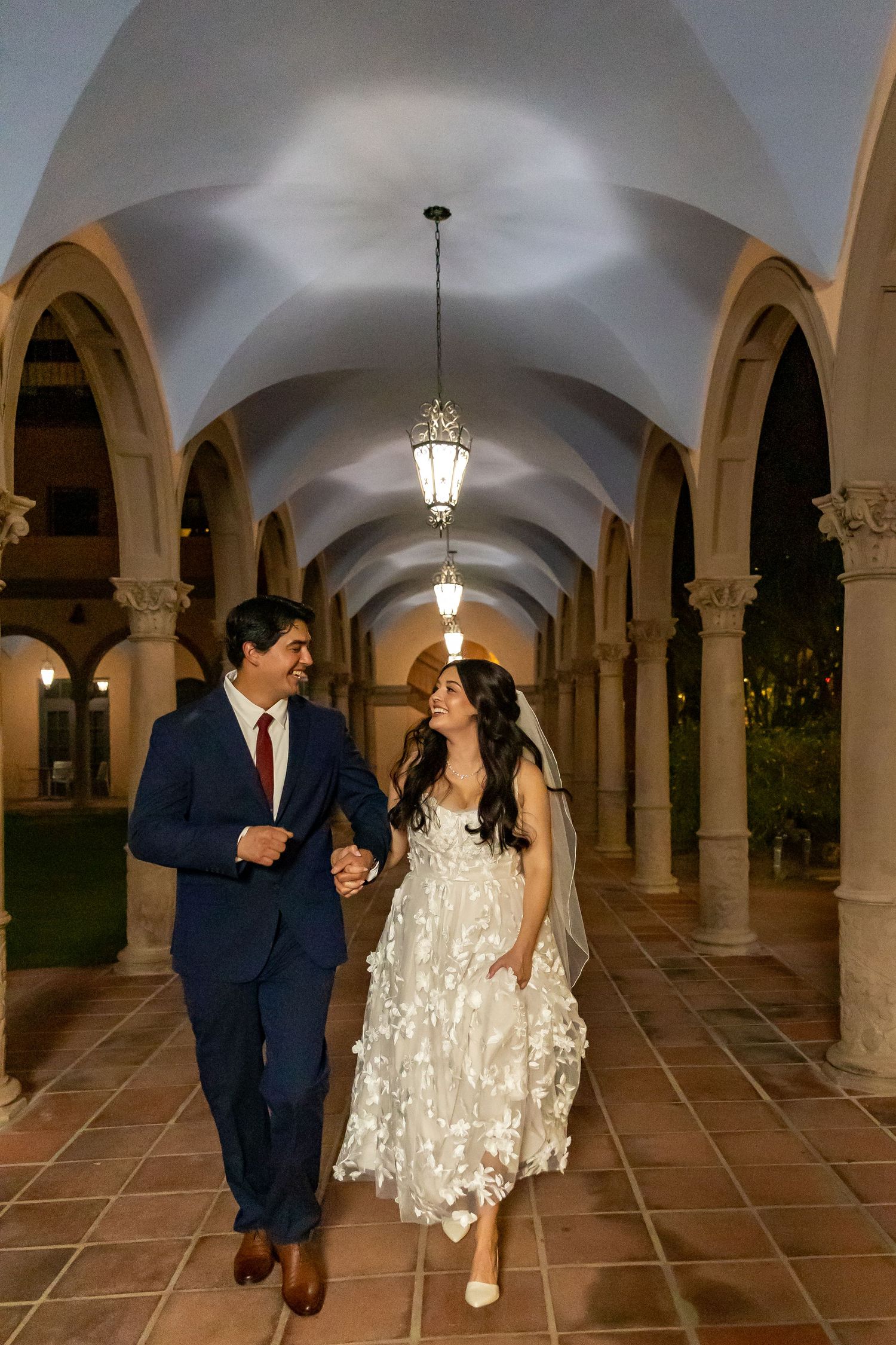 Bride and Groom beneath the Pima County Historic courthouse arches in Tucson