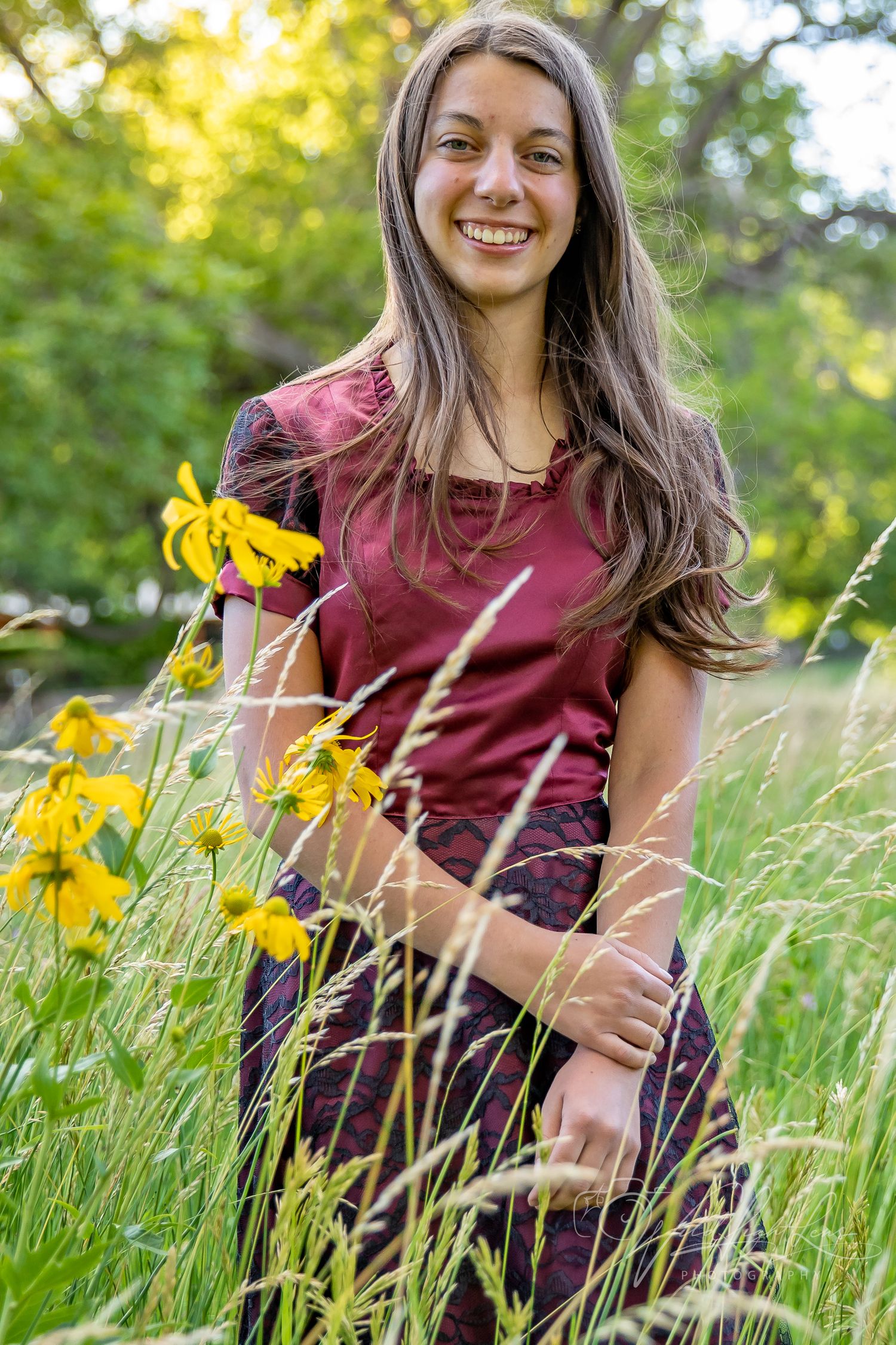 Senior portrait surrounded by wildflowers in Eagar Arizona