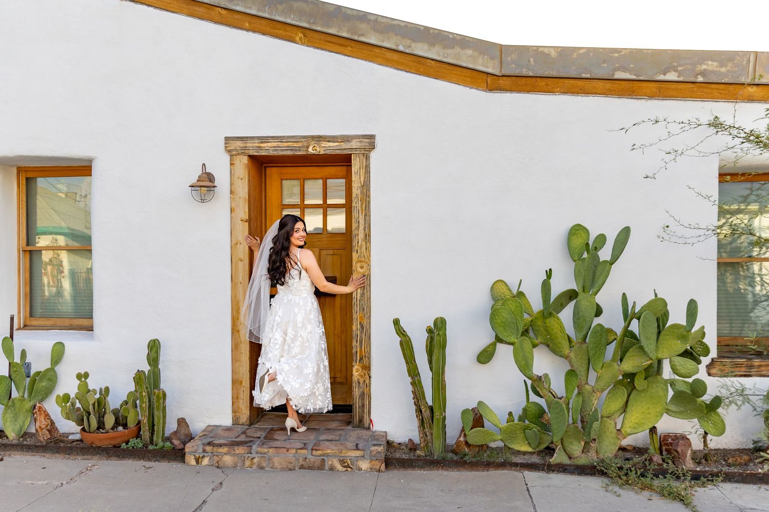 Candid photograph of bride smiling on her wedding day