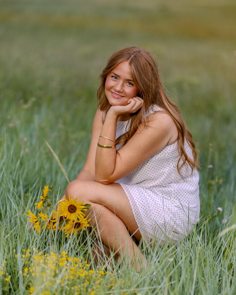 Senior girl photographed with wildflowers