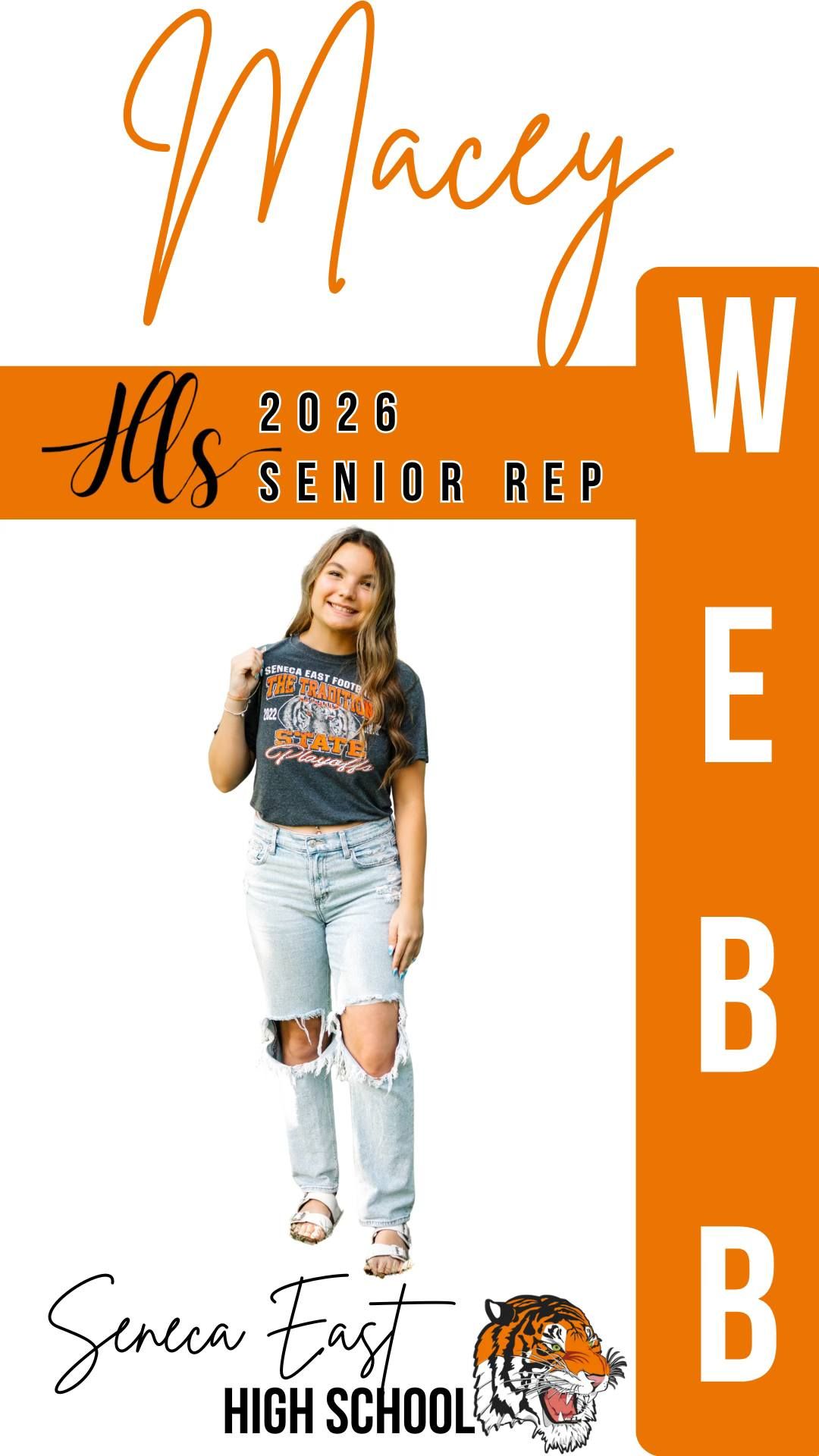 Senior photo featuring light denim and casual style against orange branded background.