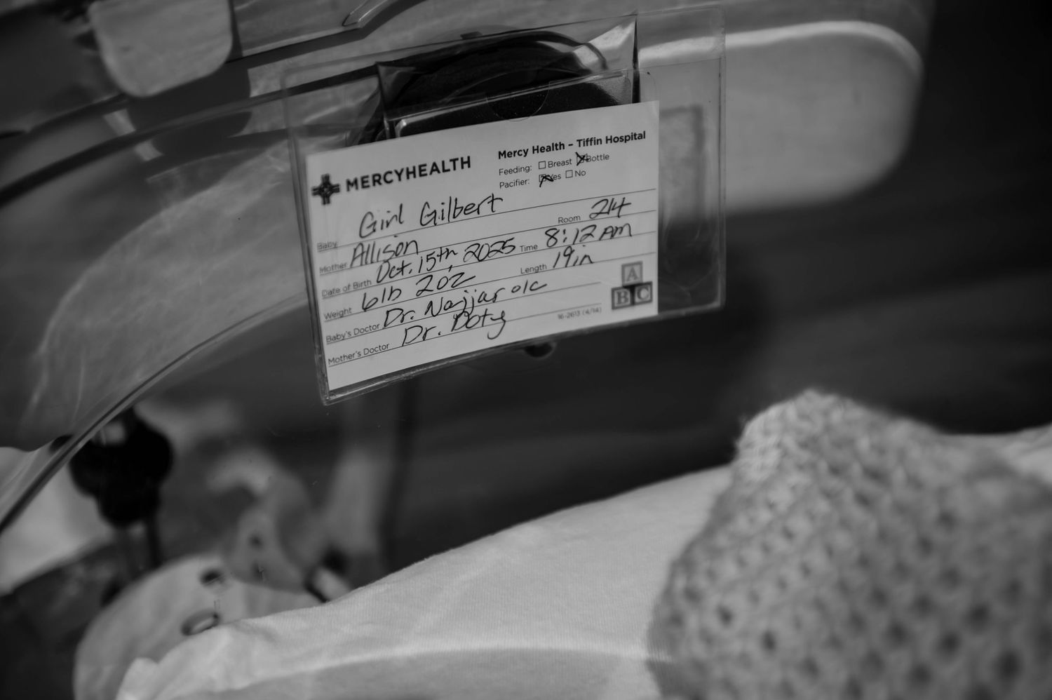 Black and white close-up of medical paperwork and documentation.