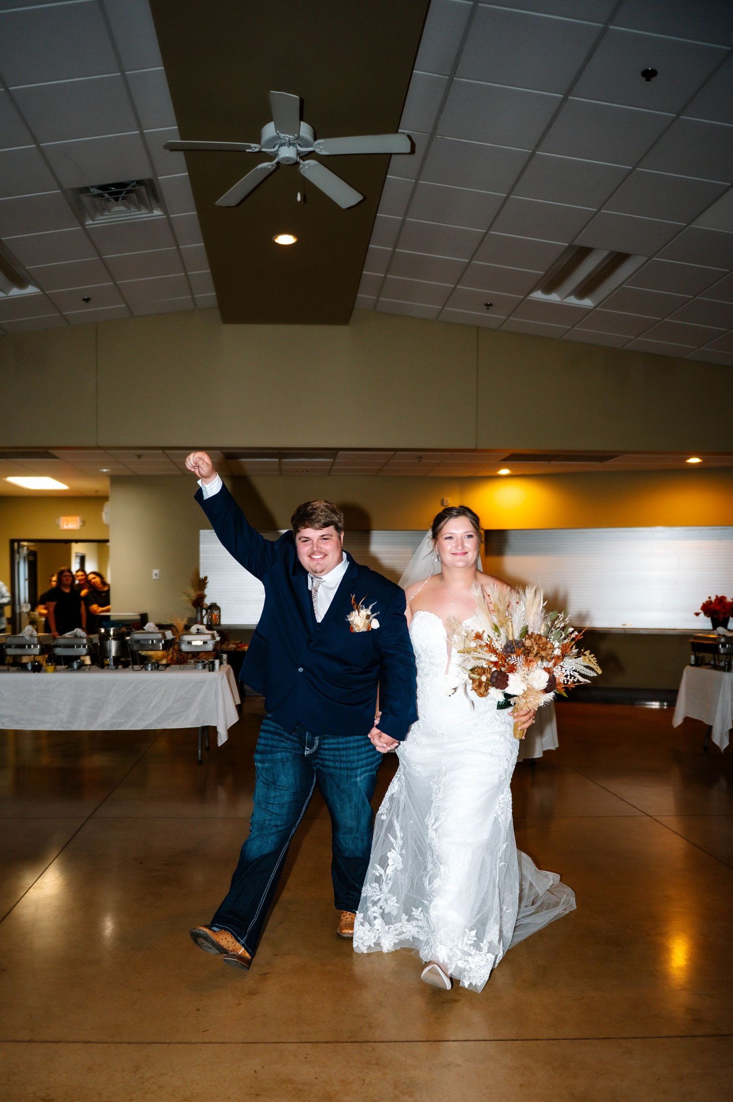 Wedding dance sequence showing playful dips and spins on a reception hall dance floor.
