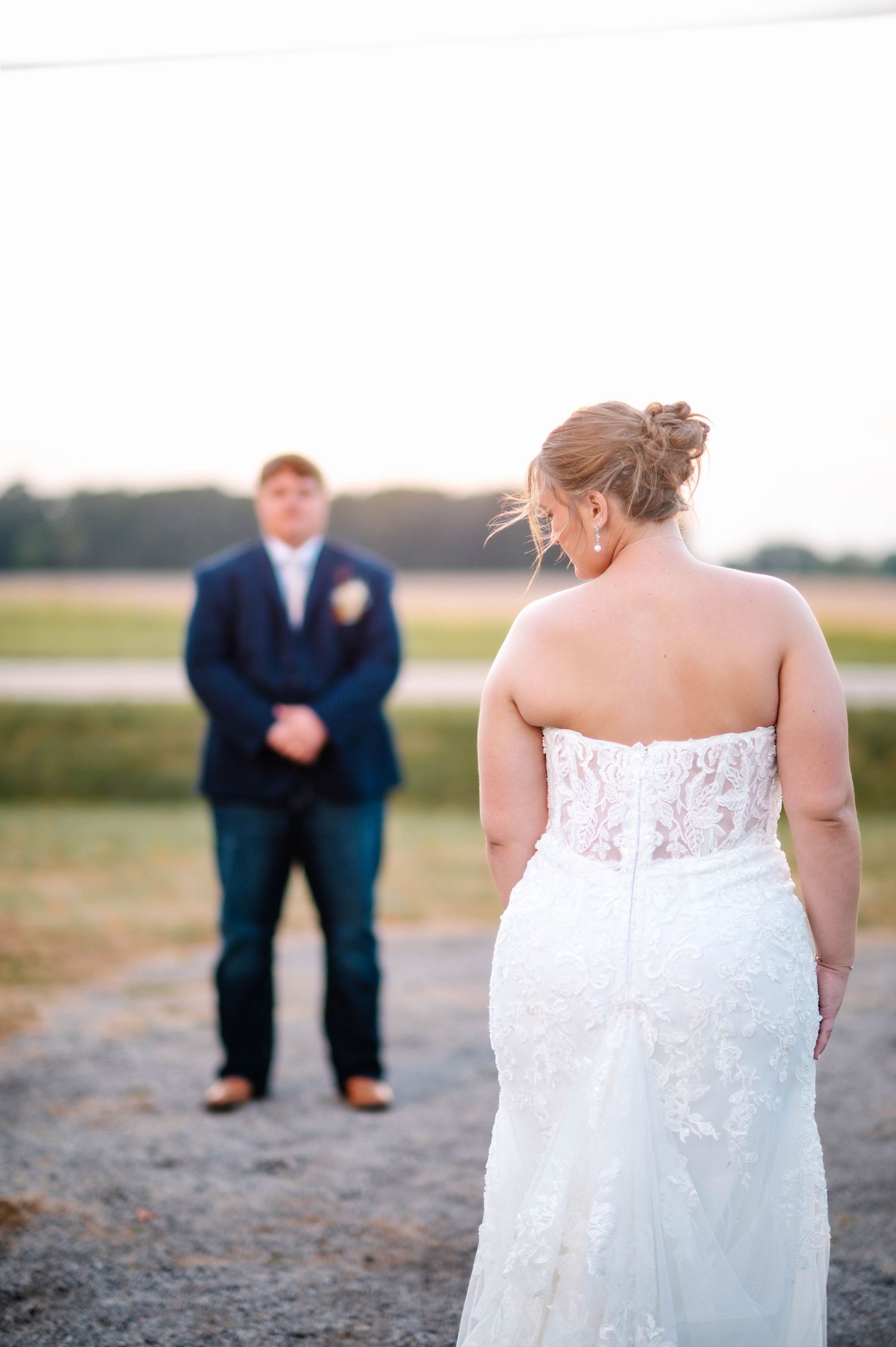 Artistic wedding photo series focusing on details of a lace wedding dress.