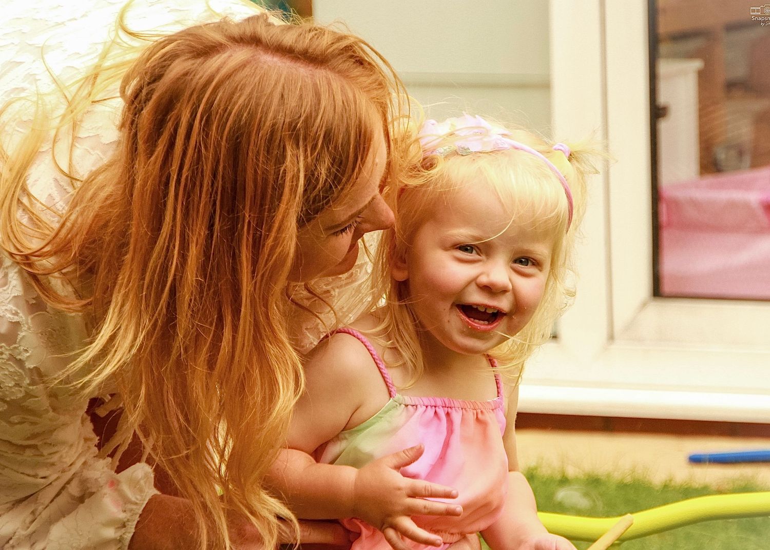 candid photo of mum and daughter