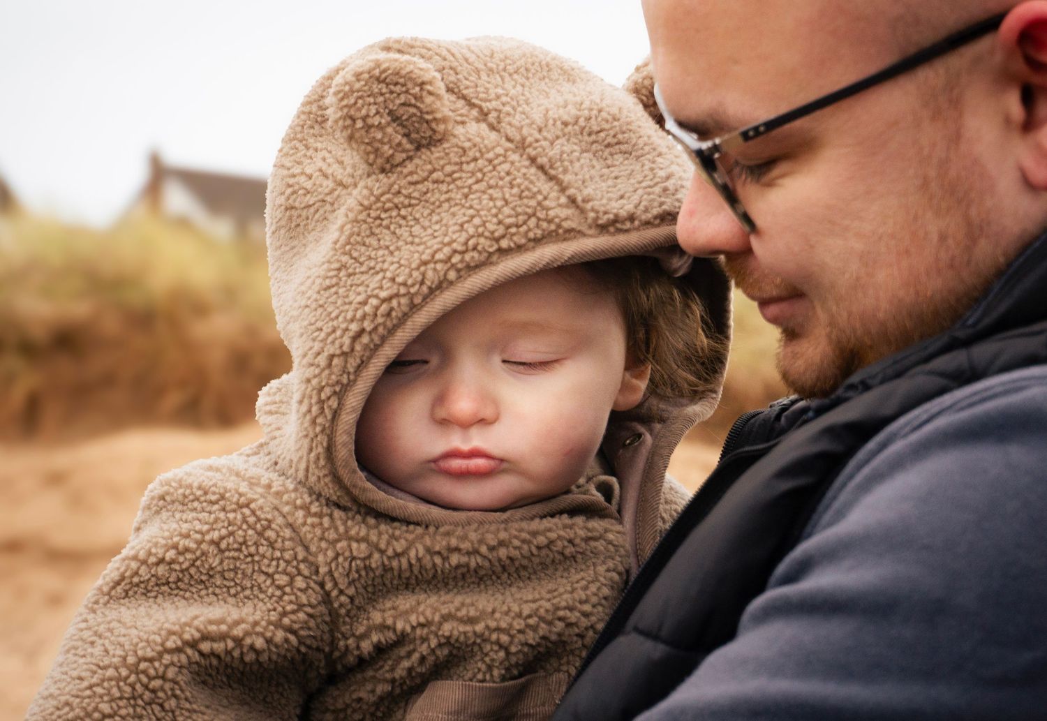 Baby sleeping during a warm, natural lifestyle photoshoot