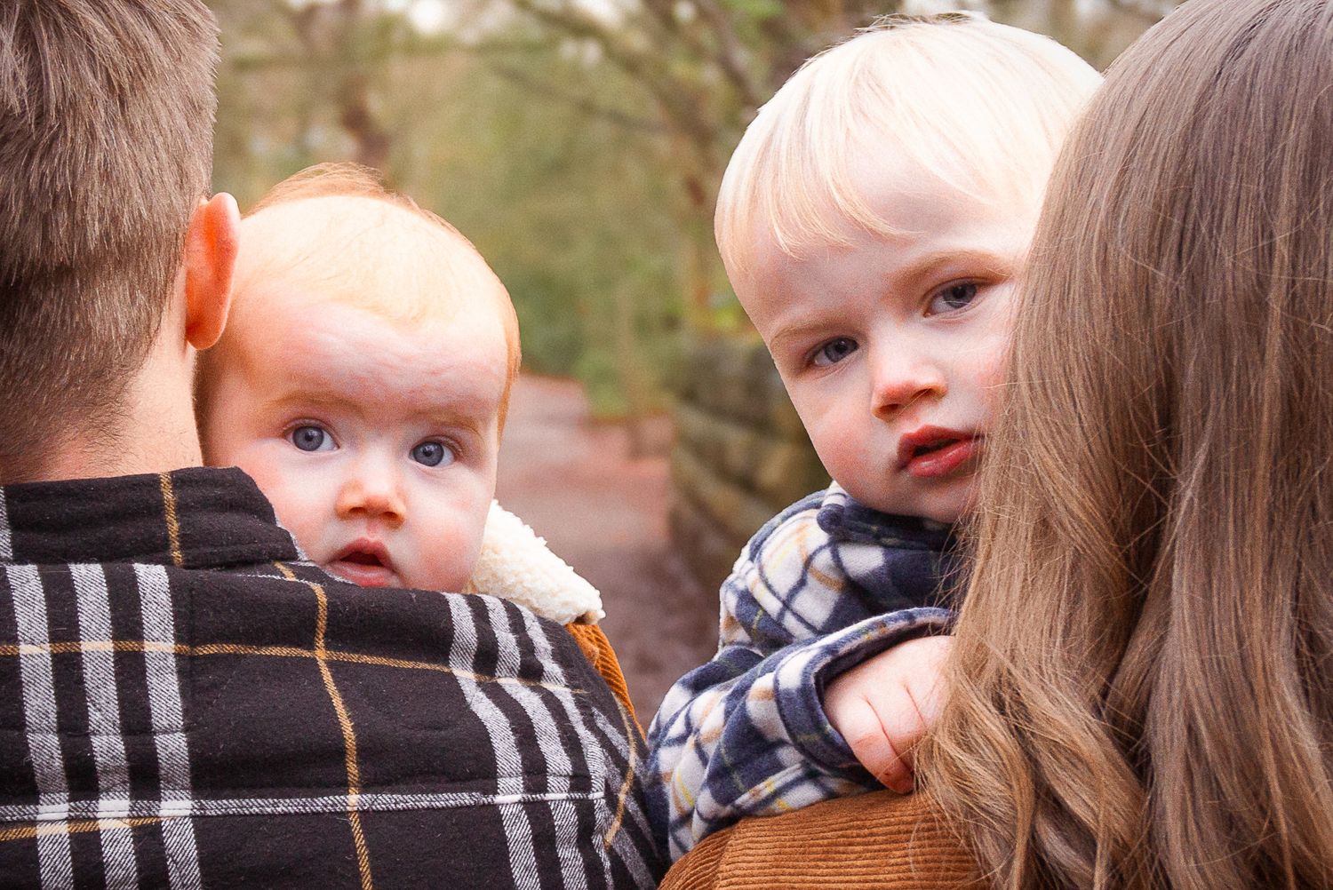candid photos of kids during their family photo session in the woodlands
