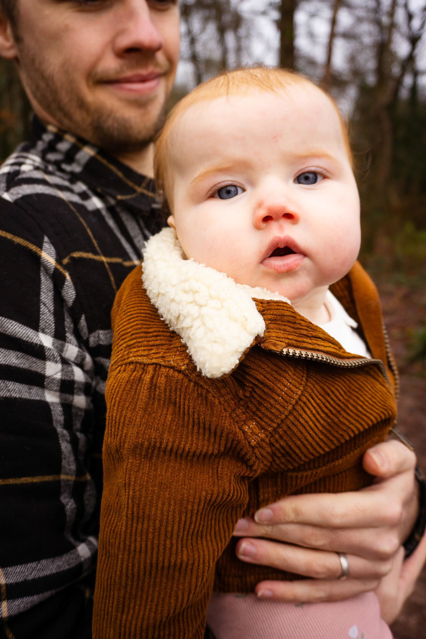 Baby staring into the camera during a warm, natural lifestyle photoshoot