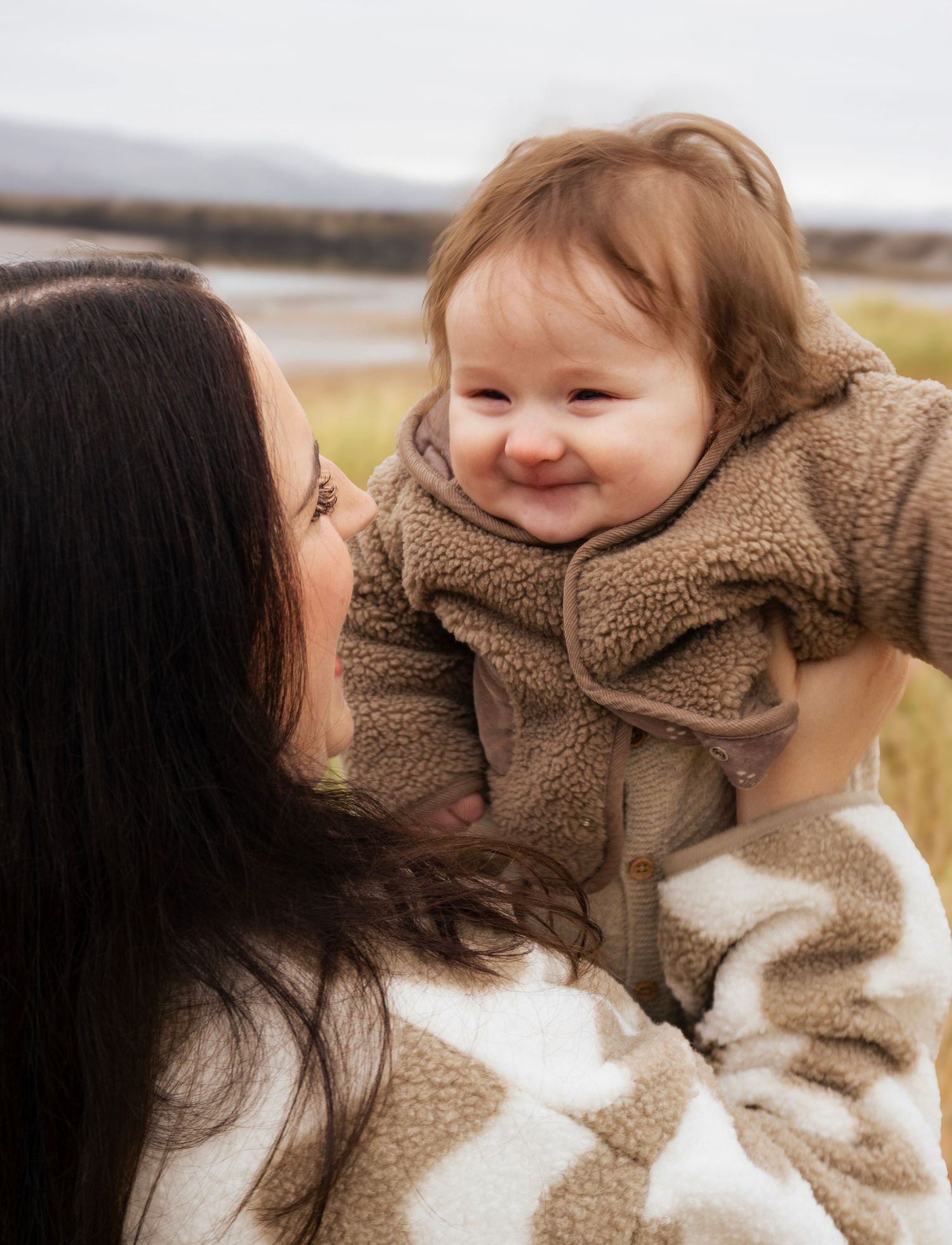 Baby smiling during a warm, natural lifestyle photoshoot