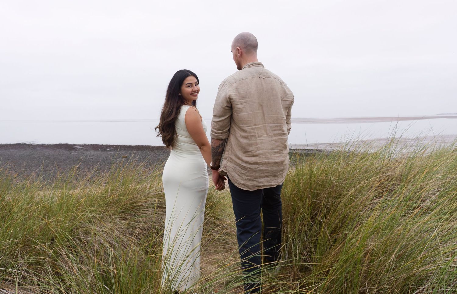 engagement session of couple at the beach
