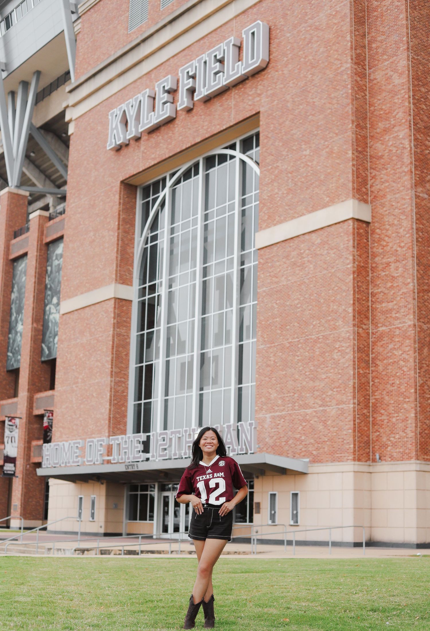 Wide shots of someone posing near a brick university building exterior.