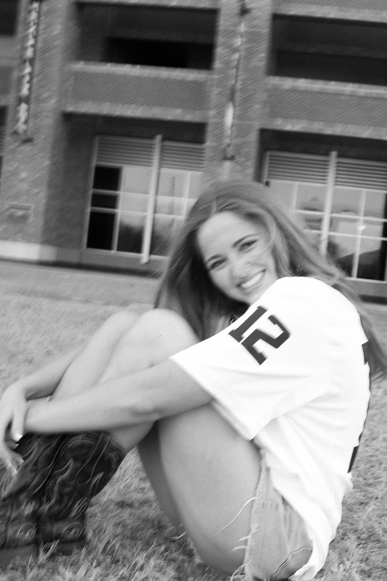 A series of playful poses in white clothing against a grassy background.