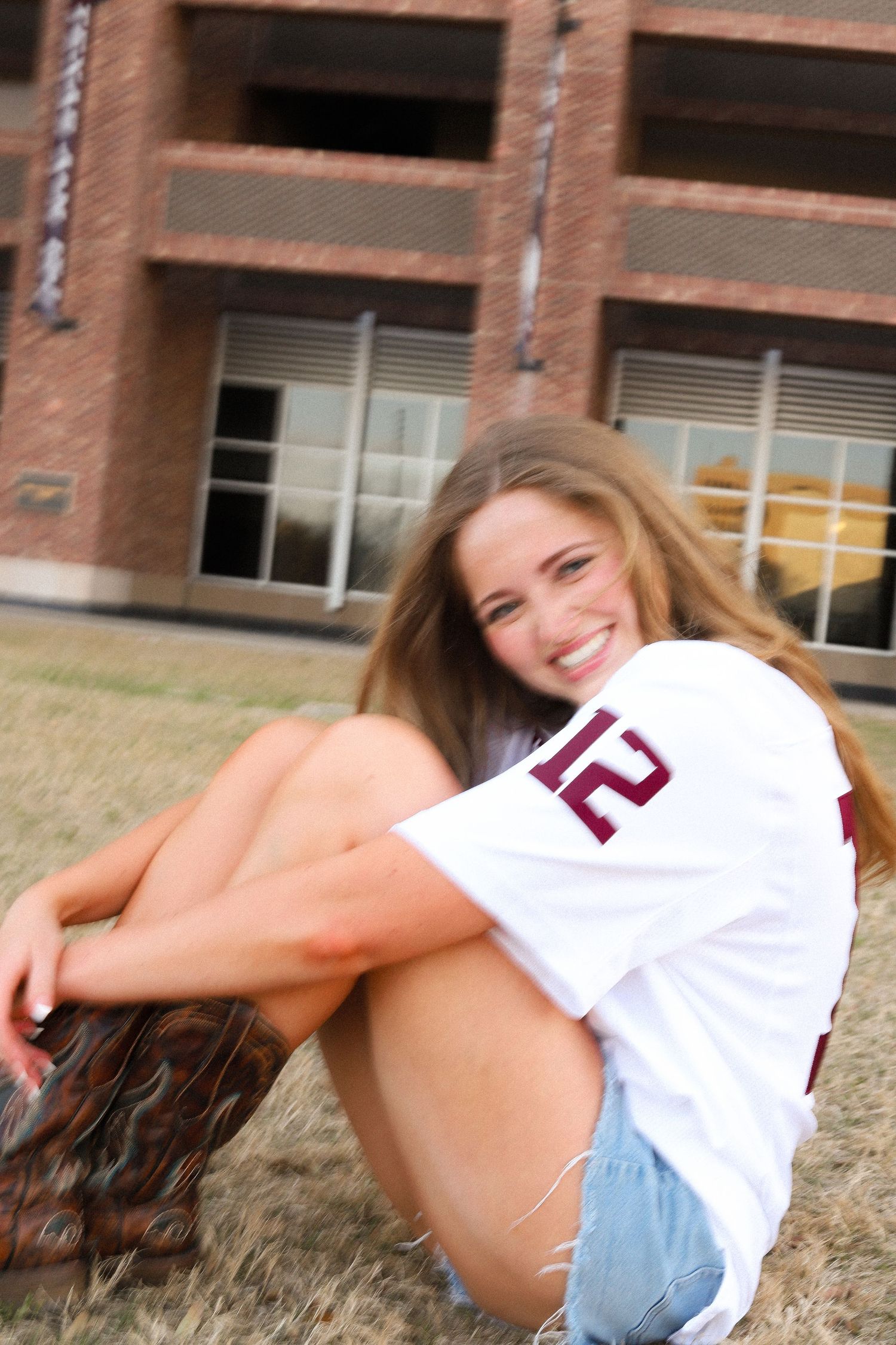 A sequence of playful outdoor portraits featuring someone in casual attire on grass.