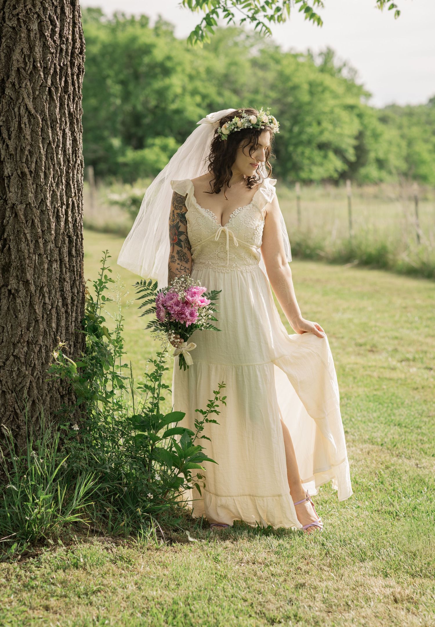 Outdoor bridal portrait of a bride holding a pink wildflower bouquet during an intimate elopement in Murfreesboro, Tennessee