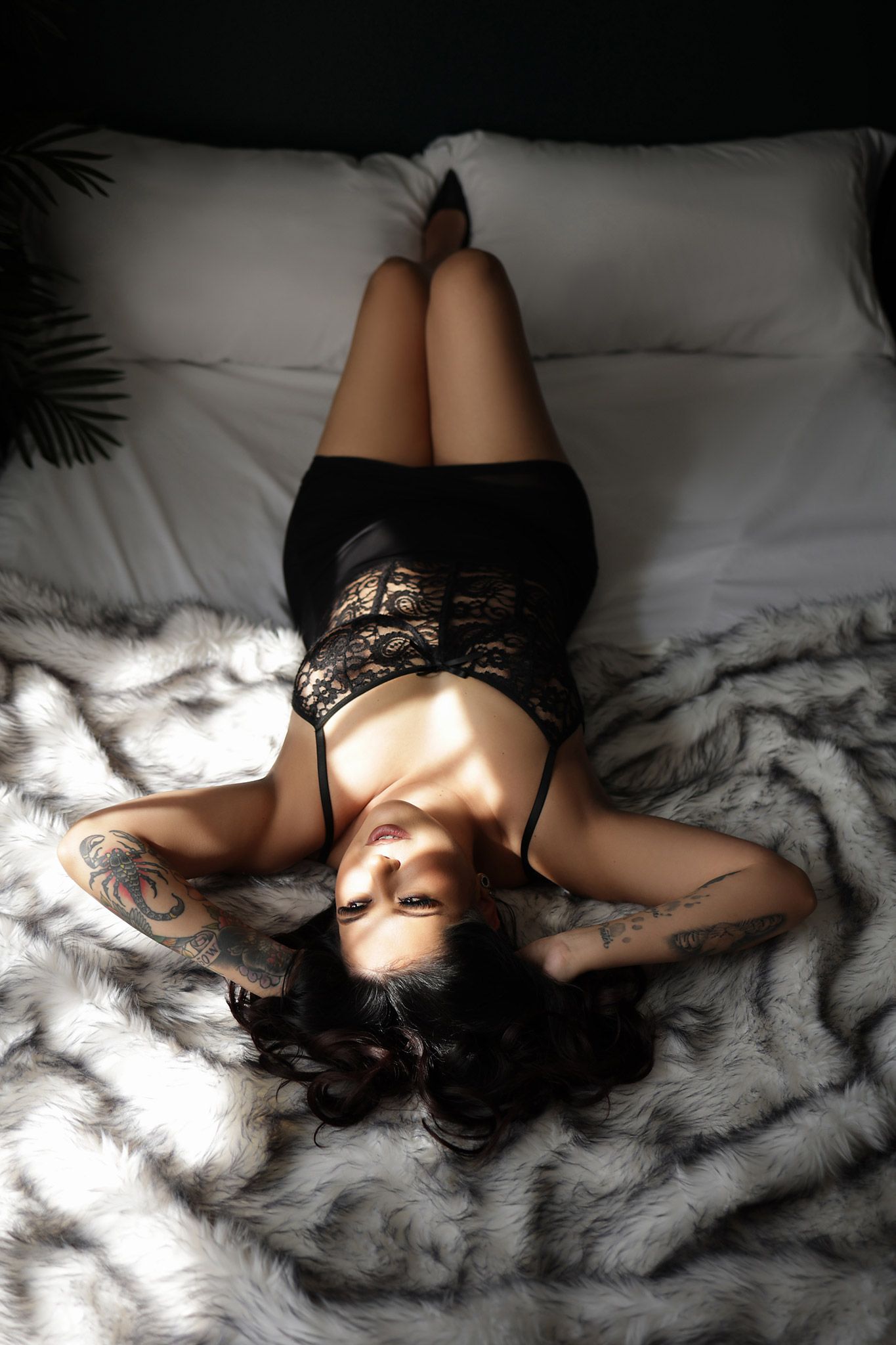 Woman posing confidently during a professional boudoir photoshoot