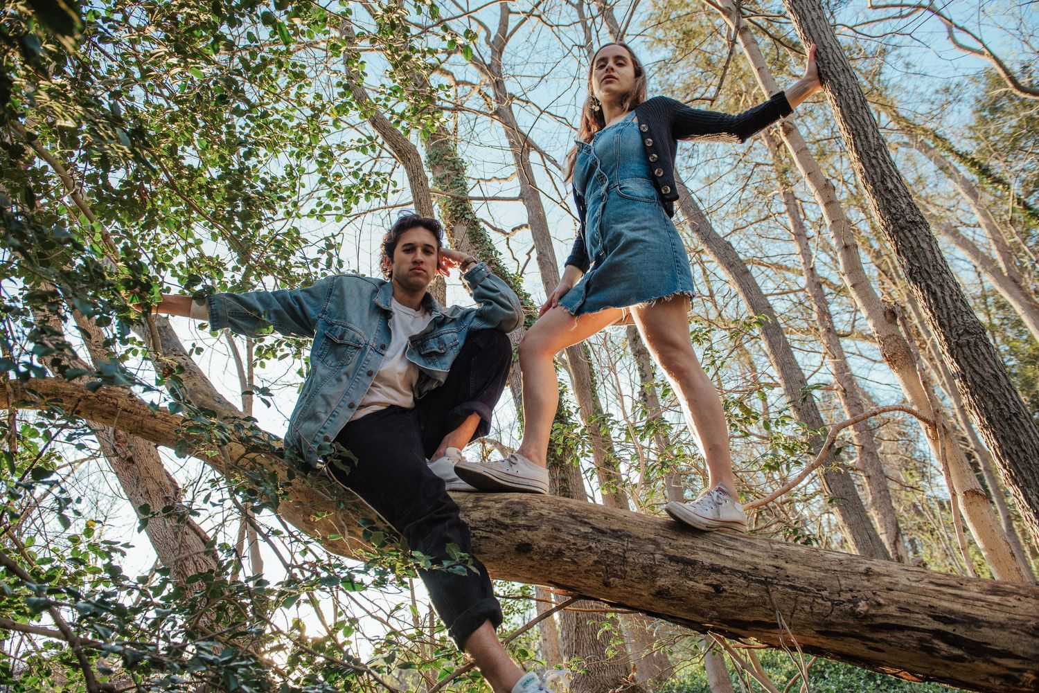 A sequence of photos showing someone climbing and balancing on a fallen tree trunk in a forest setting.