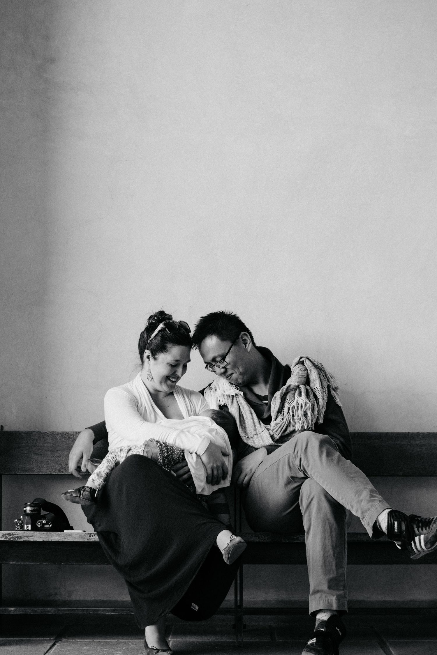 Black and white sequence showing intimate moments on a couch.