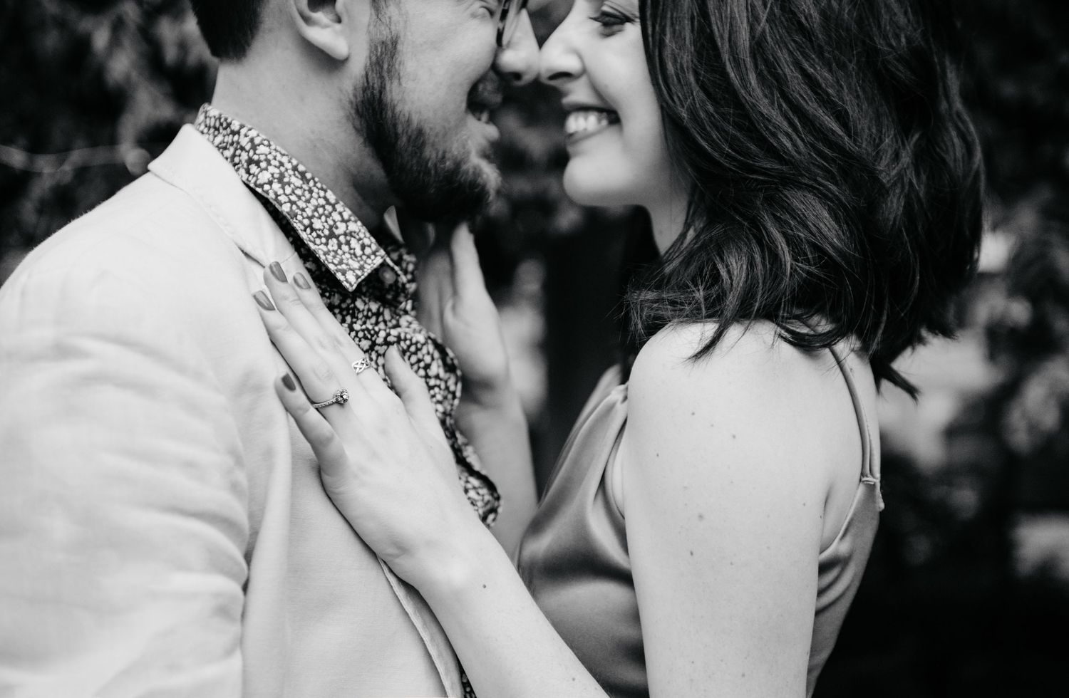 Black and white romantic wedding photo collage showing intimate moments between bride and groom at reception.