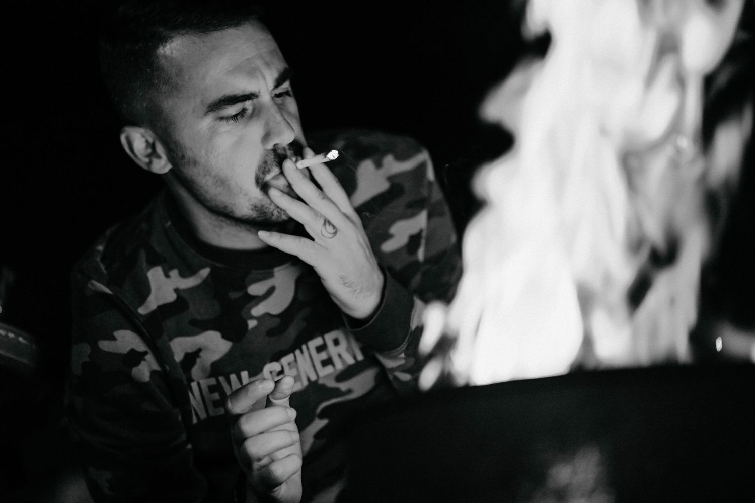 Black and white performance photos of musicians playing instruments on stage with dramatic lighting effects.