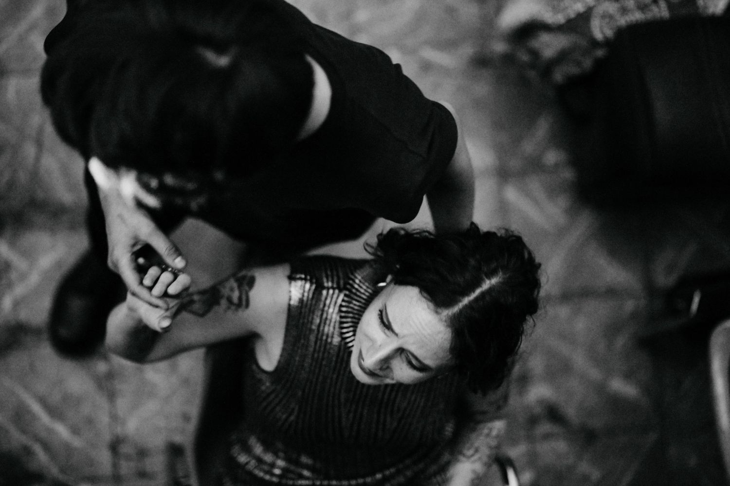 A series of black and white candid photographs showing people in casual moments and interactions.