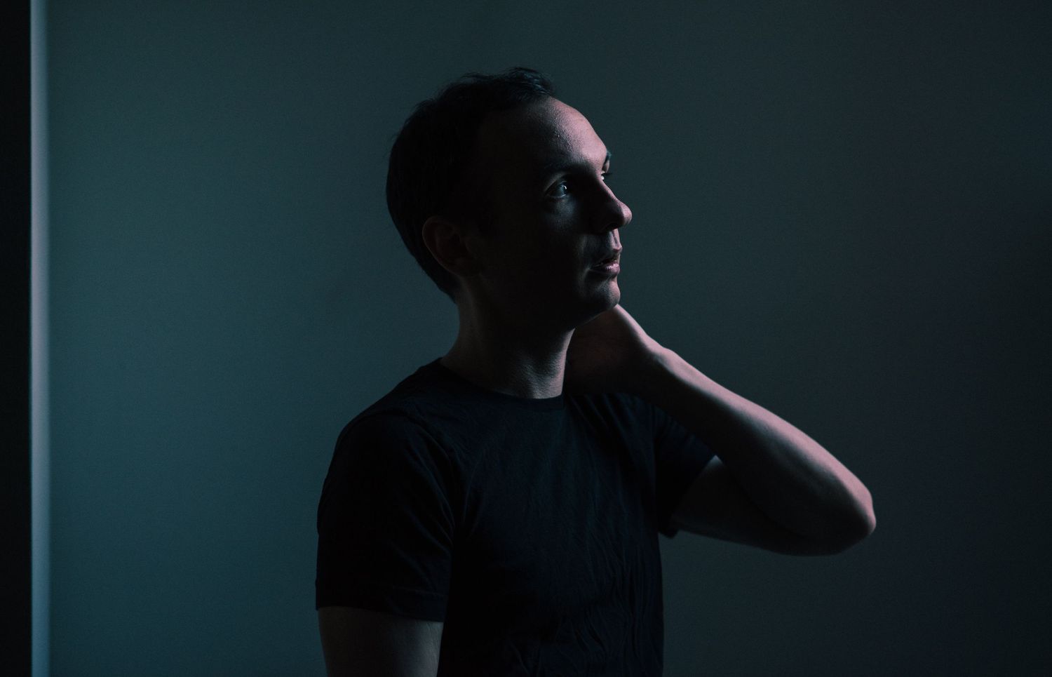 Dramatic low-key portrait sequence showing silhouettes against dark background.