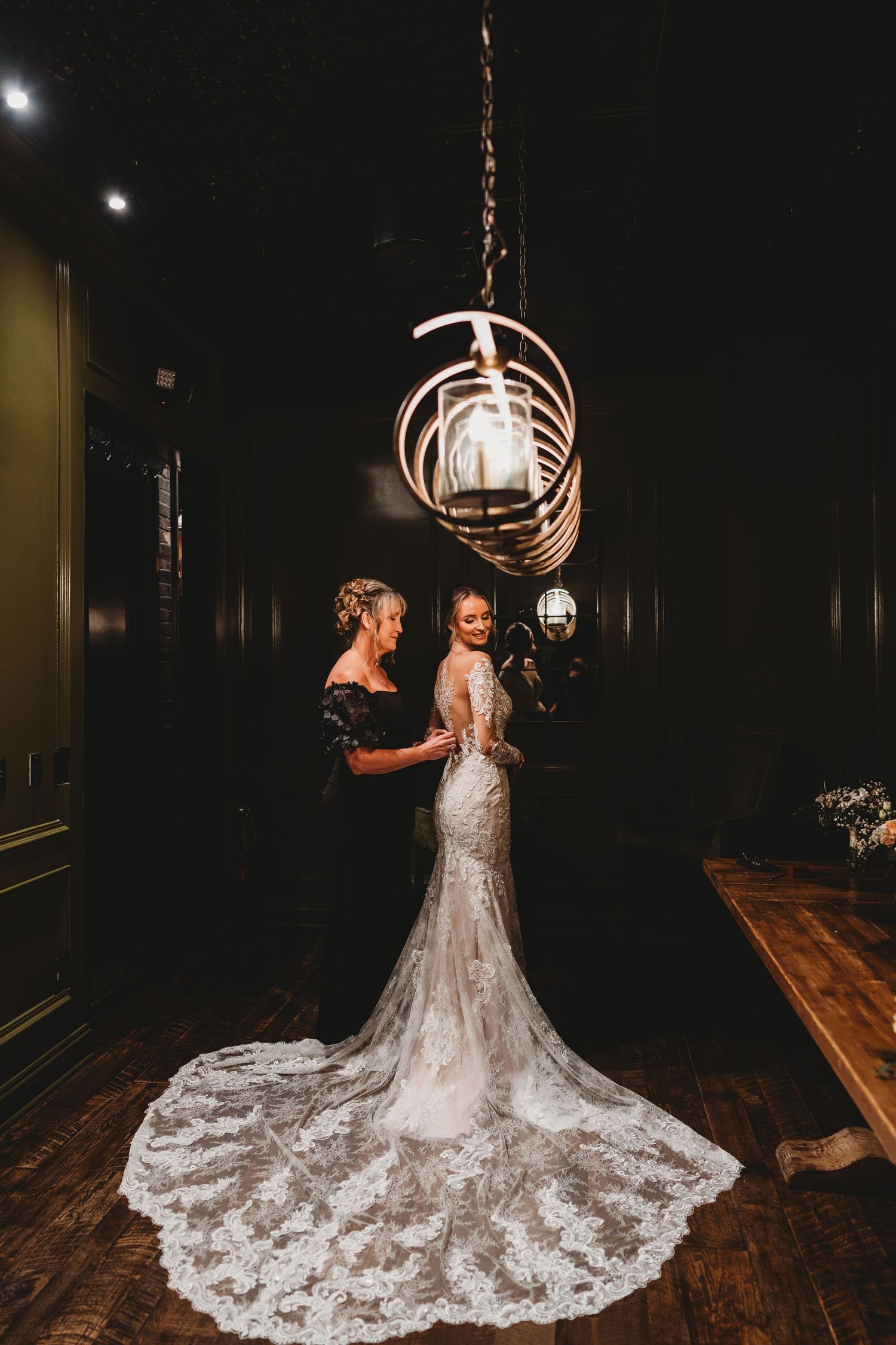 Bride and mom sharing a quiet moment together on wedding day in Florida