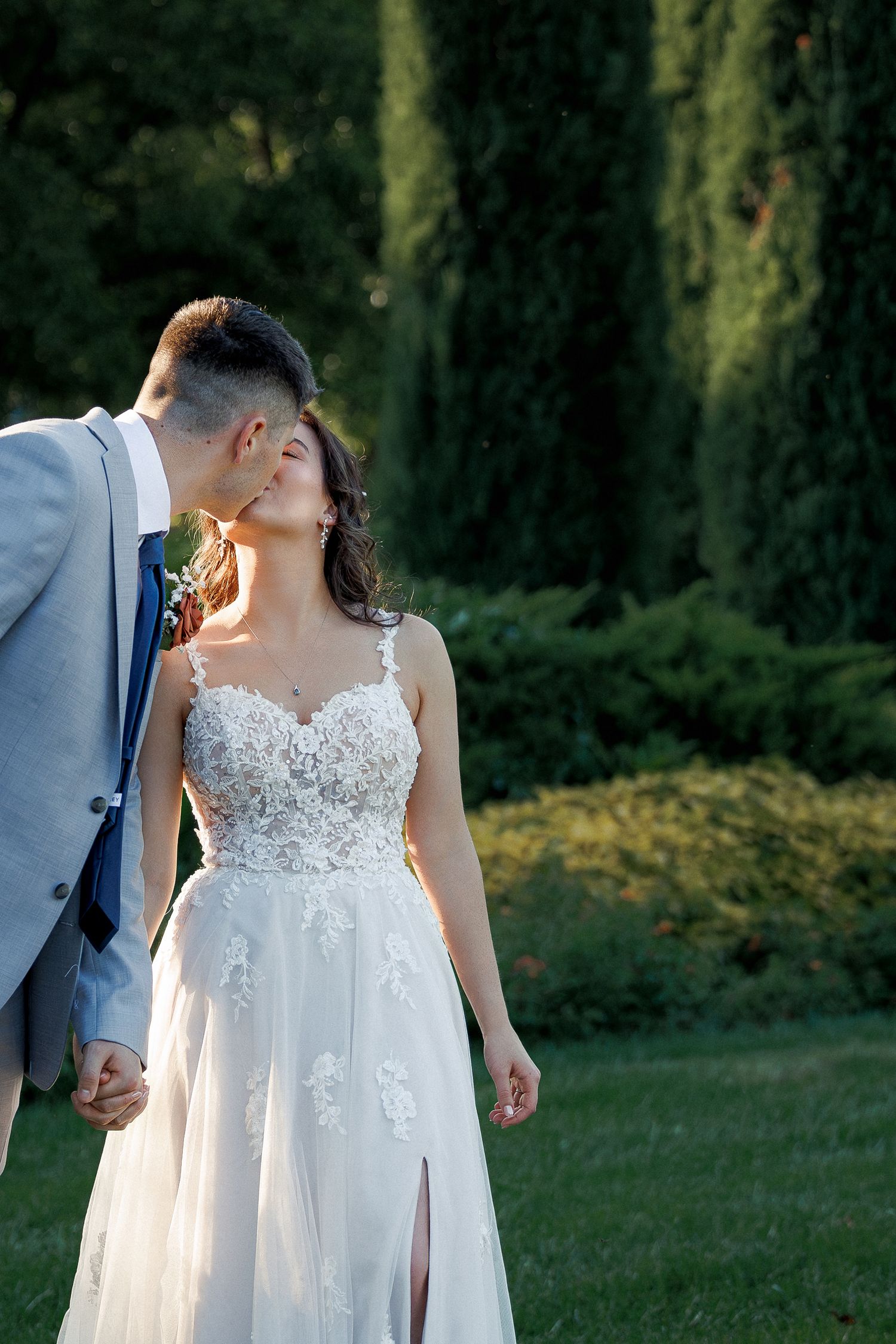 loose editorial wedding photography of a bride and groom walking