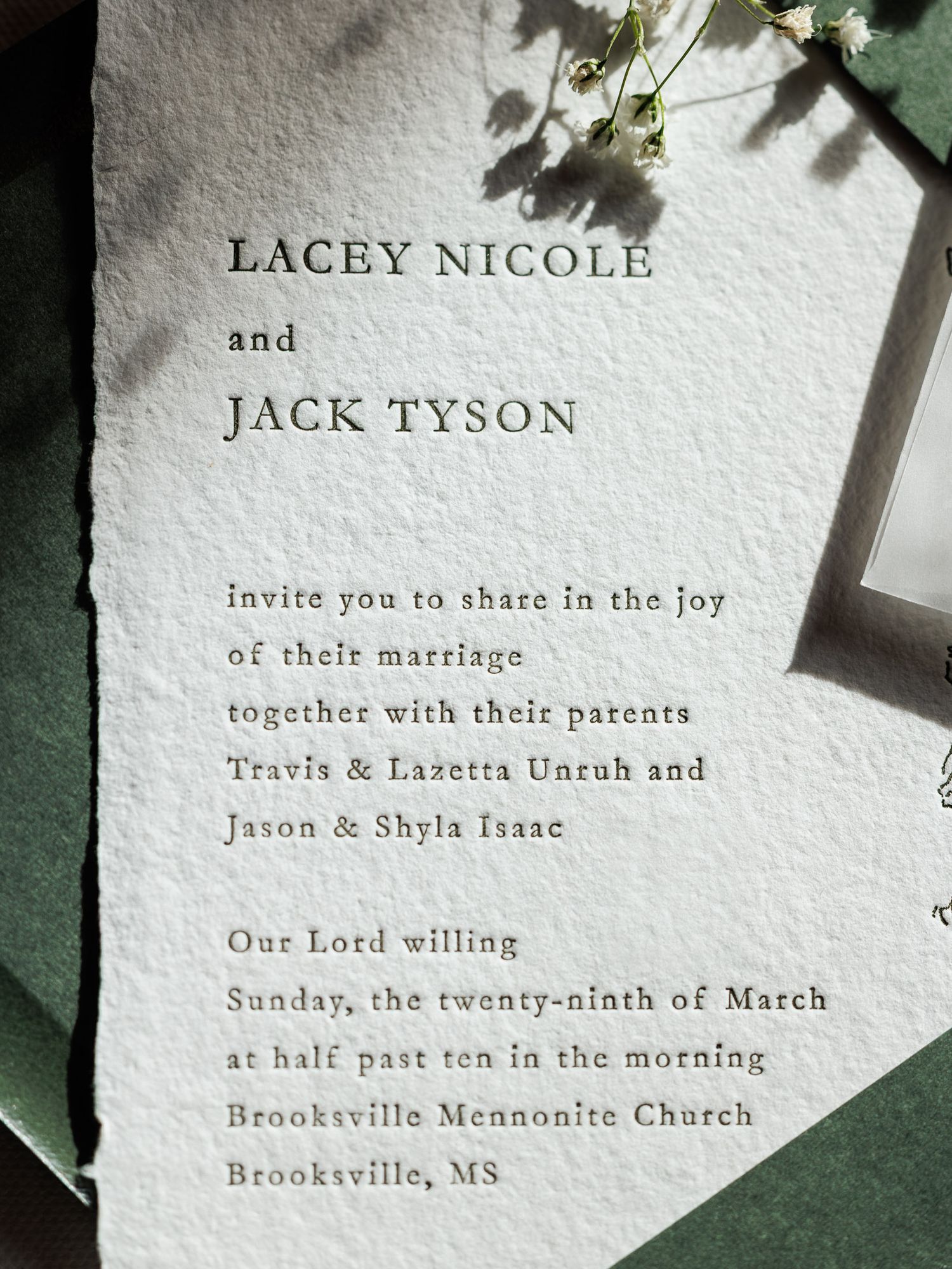 A letterpress wedding invitation on textured paper for Lacey Nicole and Jack Tyson at Brooksville Mennonite Church.