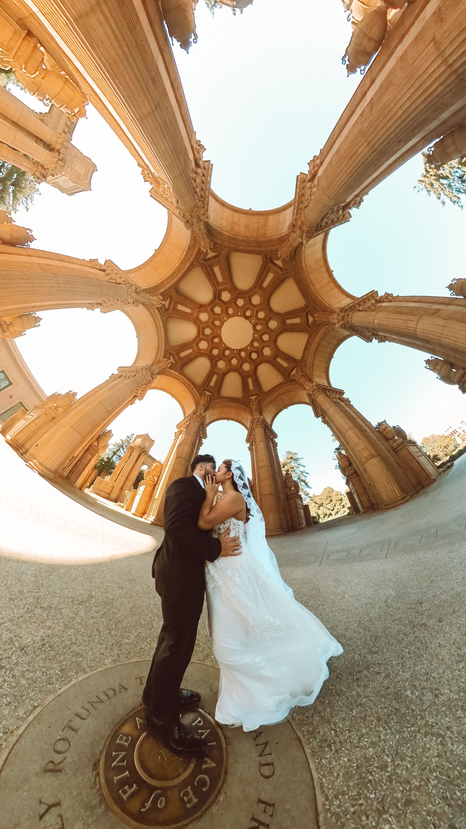 Wedding portraits of Bride + Groom photographed at the Palace of Fine Arts in San Francisco CA