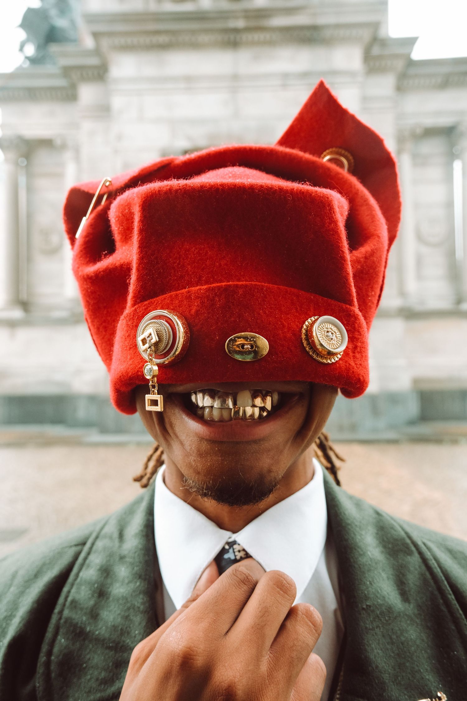 Artistic Brooklyn portrait of Ajai Kasim in front of Grand Army Plaza, highlighting fashion and creativity.