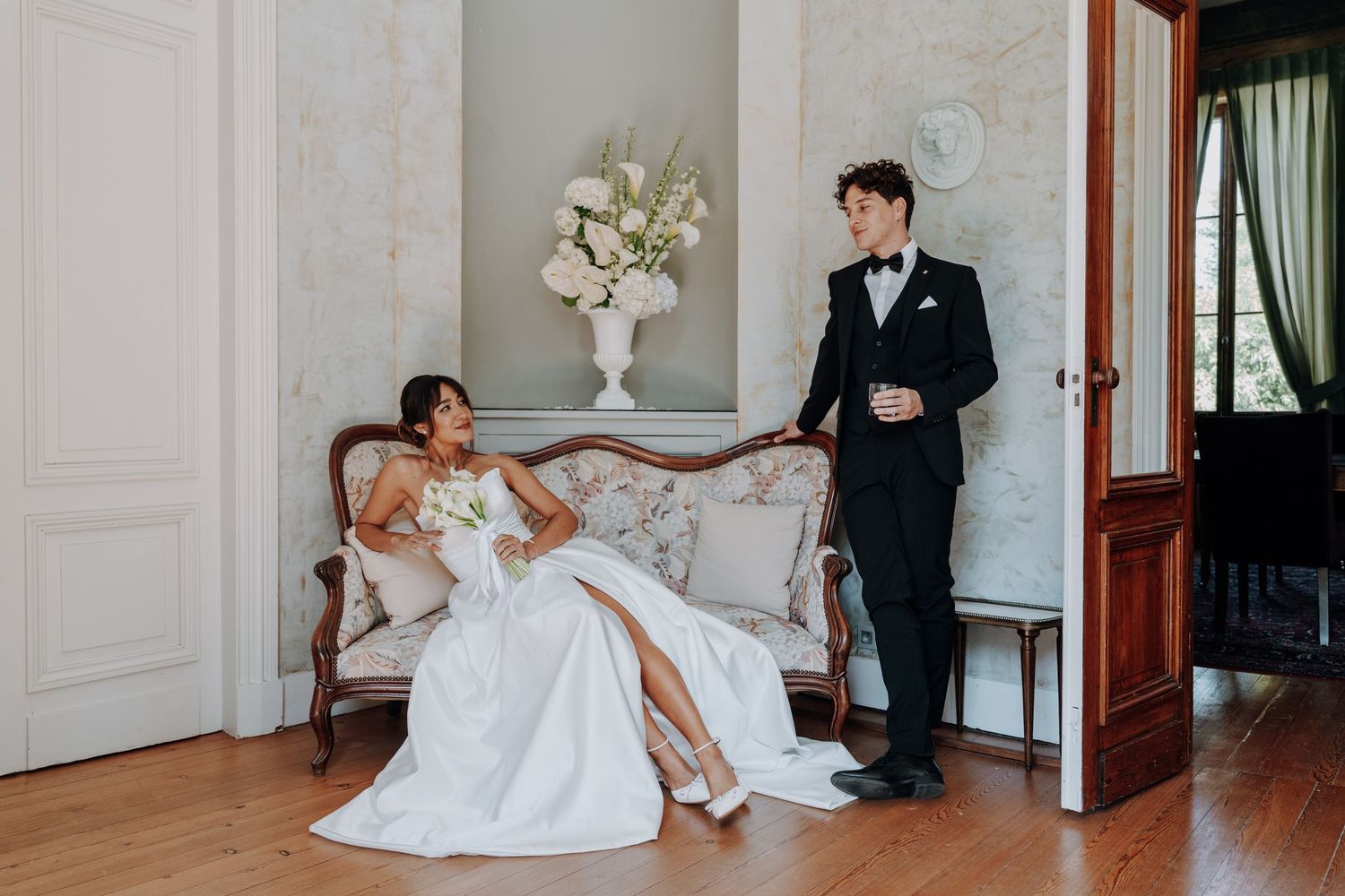 Elegant wedding portrait in classic interior with vintage furniture and decor.