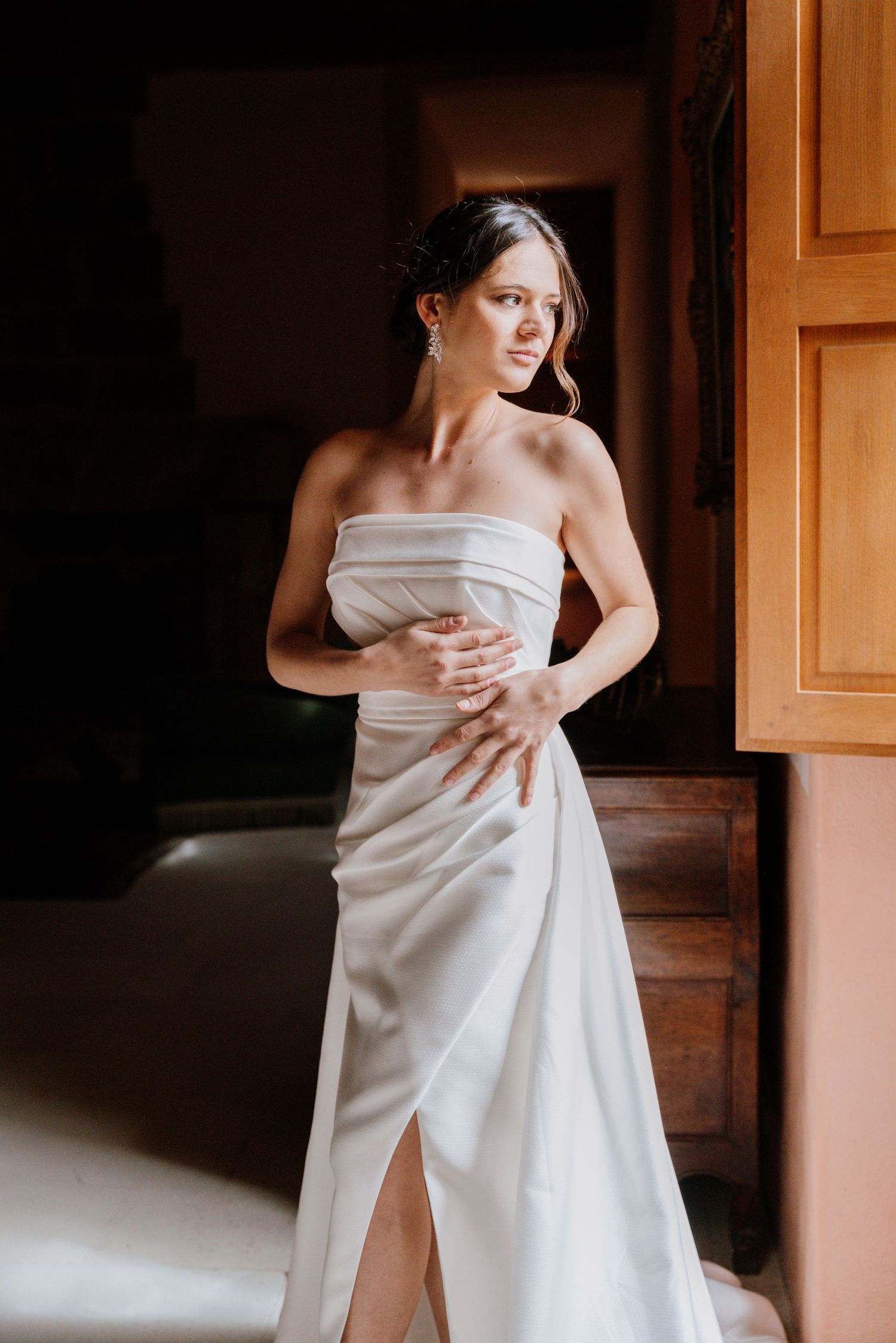 Artistic bridal portraits showing elegant white wedding dress draping.