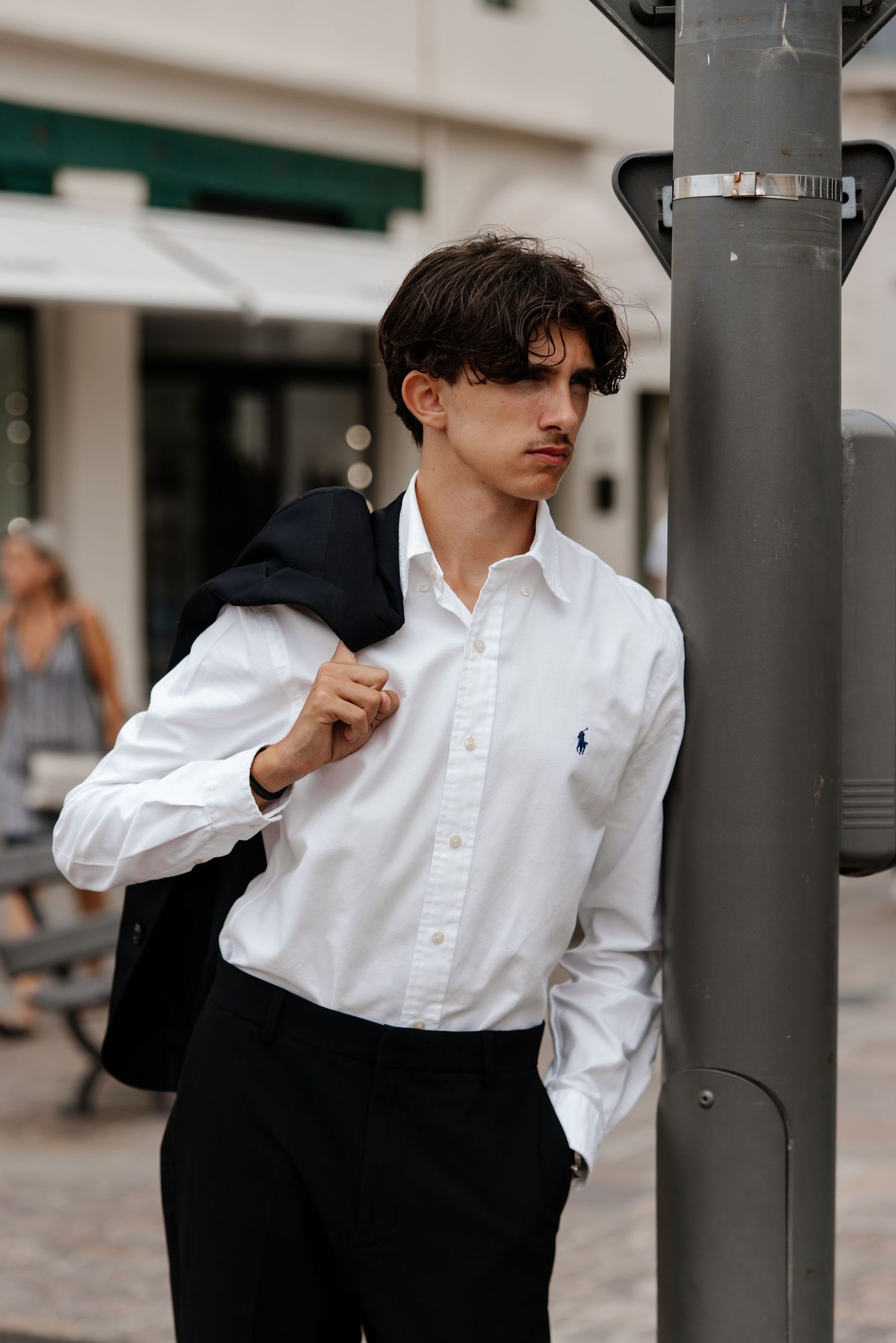 Monochromatic fashion series with classic white button-down shirt and black jacket.