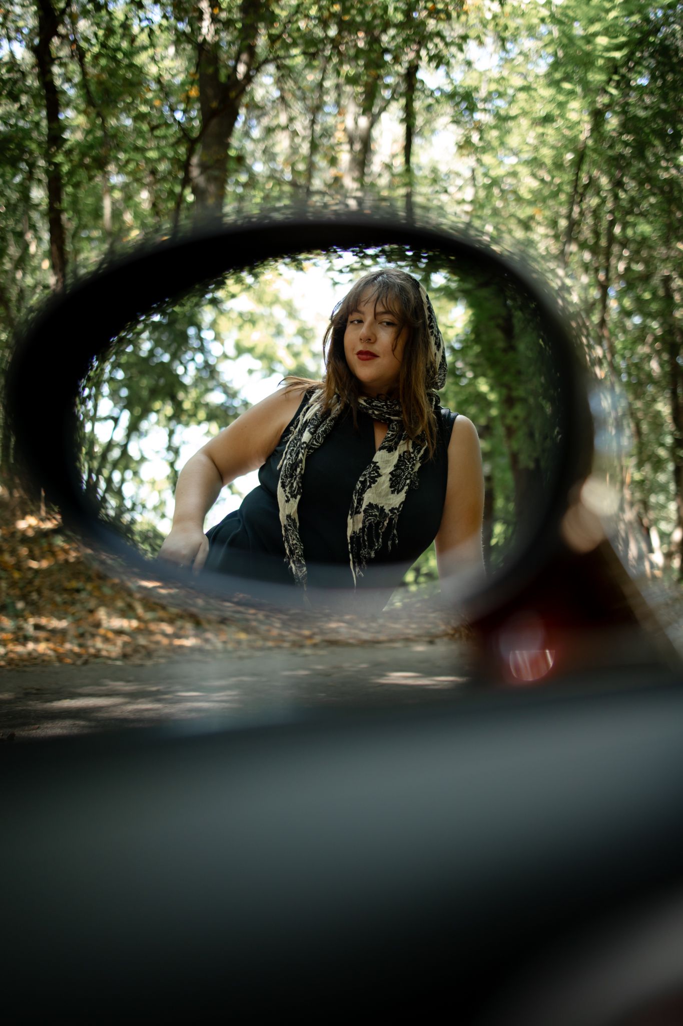 Creative through-the-windshield view sequence in forest setting.