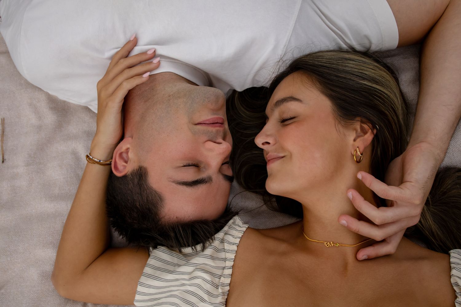 Close-up tender moments shared during a romantic outdoor photoshoot.