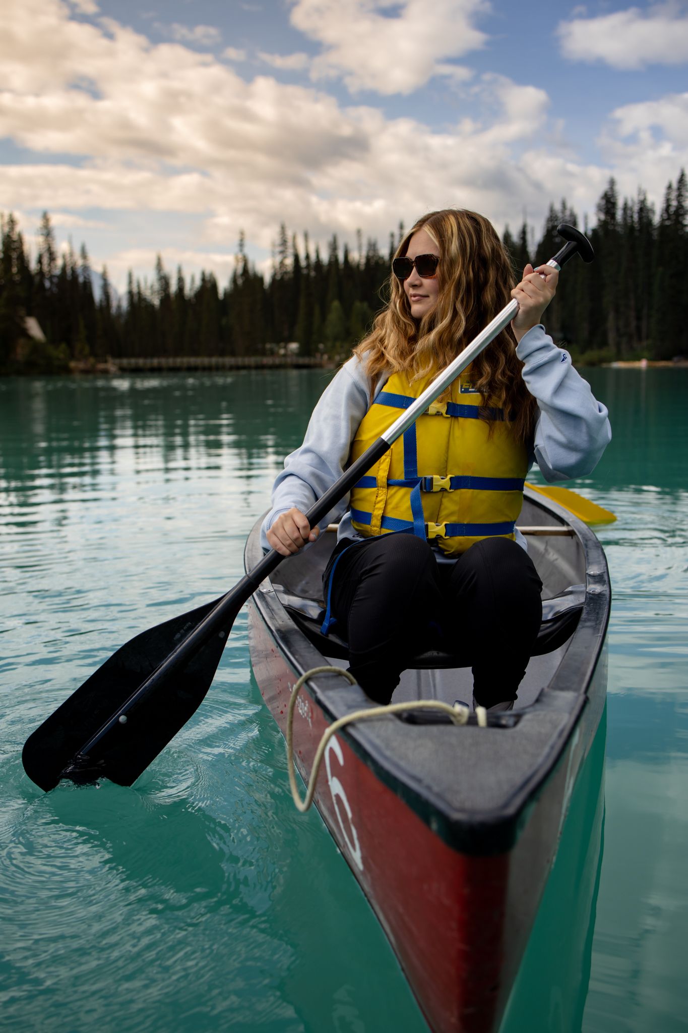 Canoeing on turquoise waters of a mountain lake.